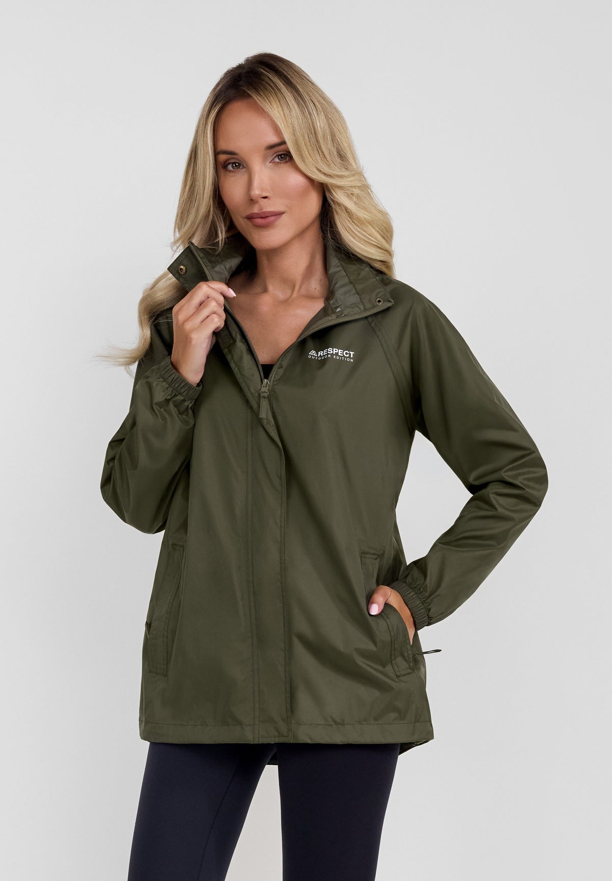 Women's khaki packaway hooded jacket, shown worn.