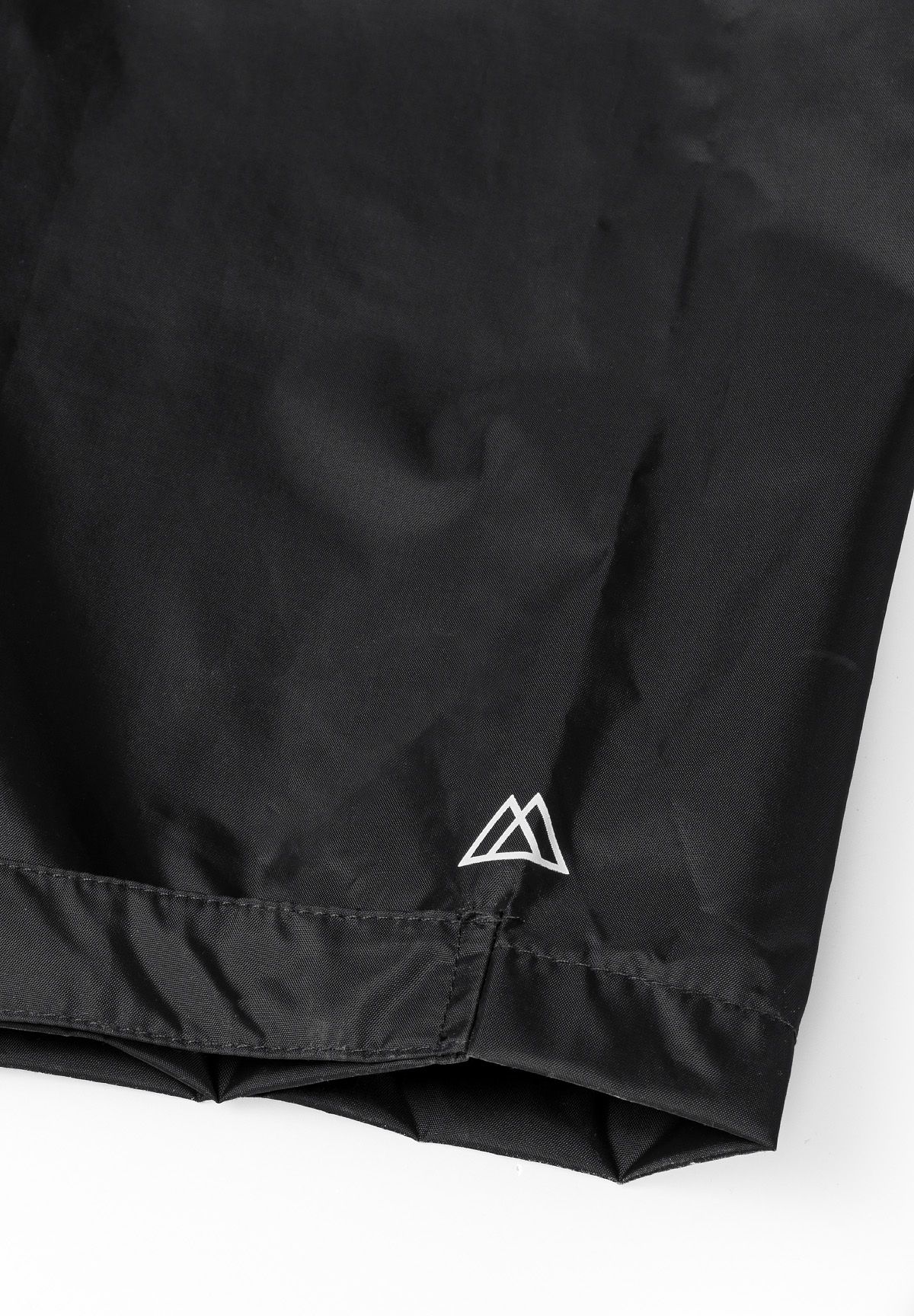 Black packaway overtrousers, hem emblem.