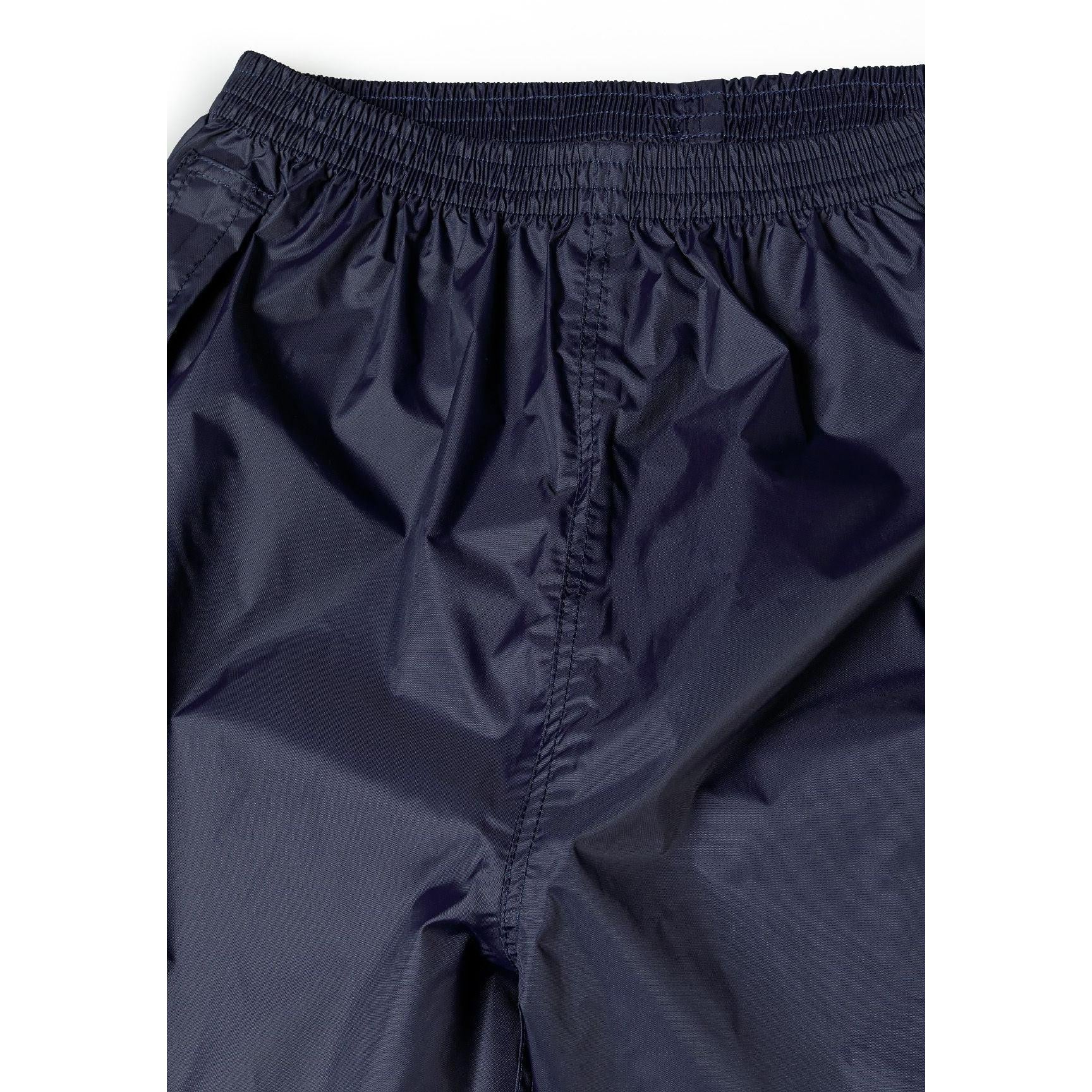 Close-up detail of navy waterproof overpants showing elastic waistband and waterproof fabric texture