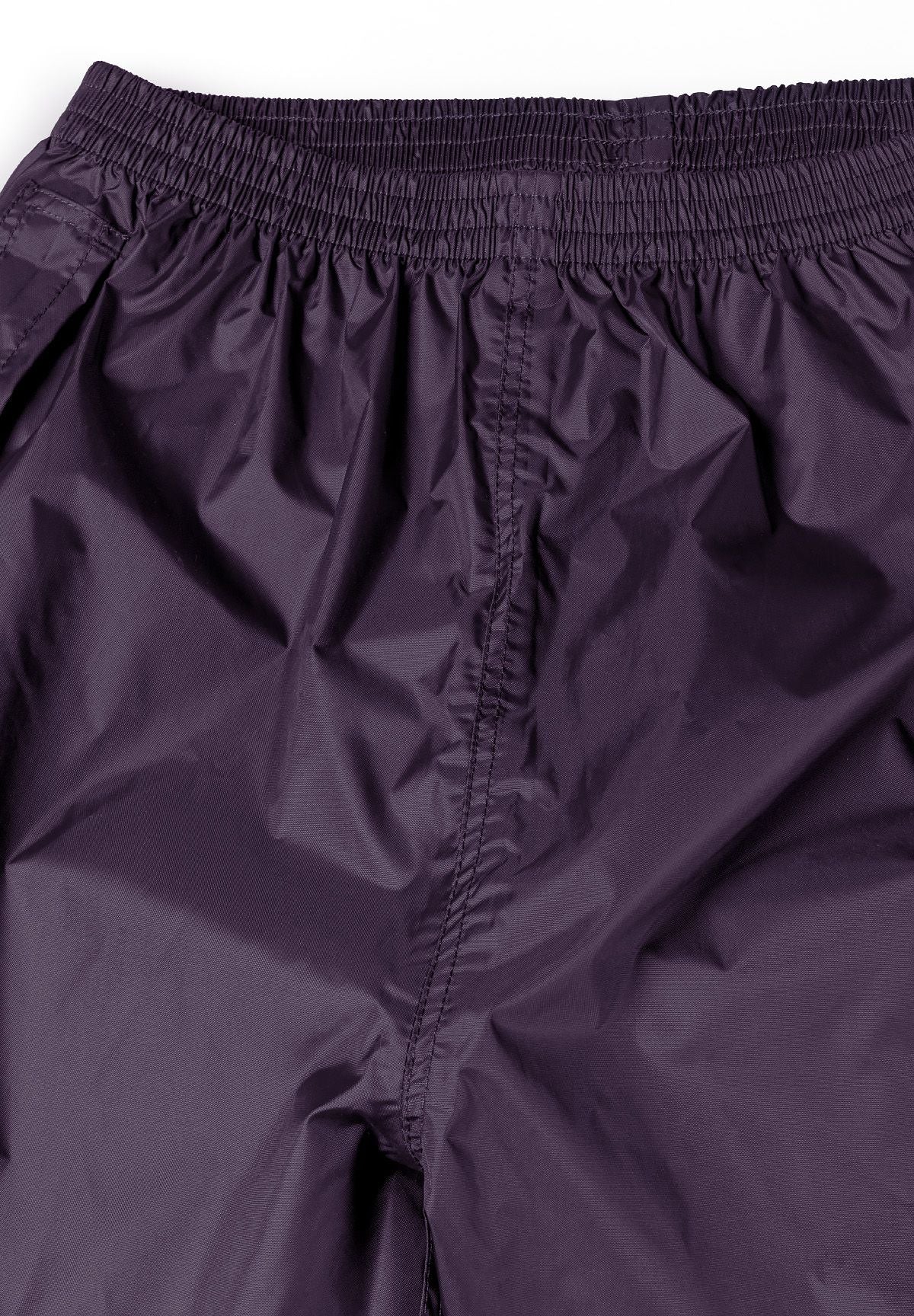 Detail of women's purple packaway waterproof overpants with elasticated waistband.