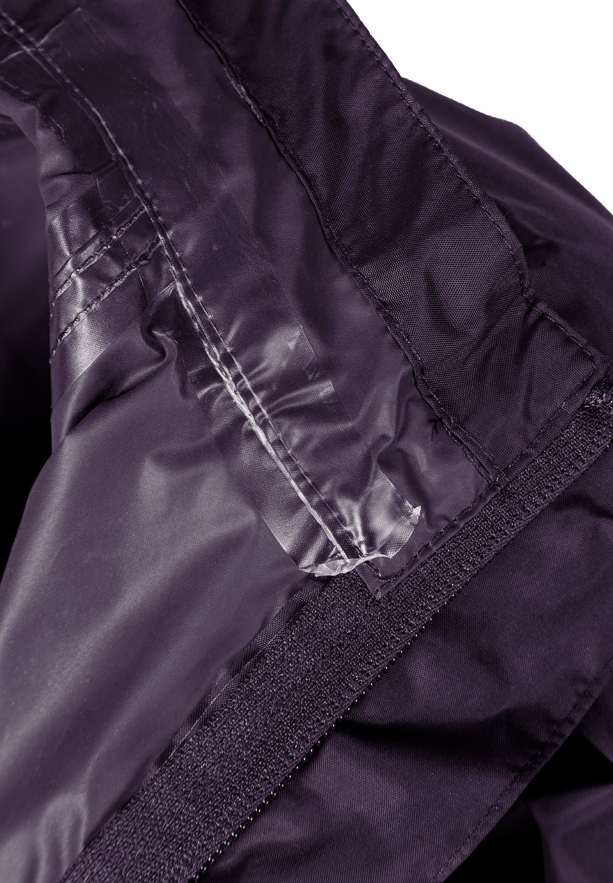 Close-up of the inside seam on the purple packaway hooded jacket.