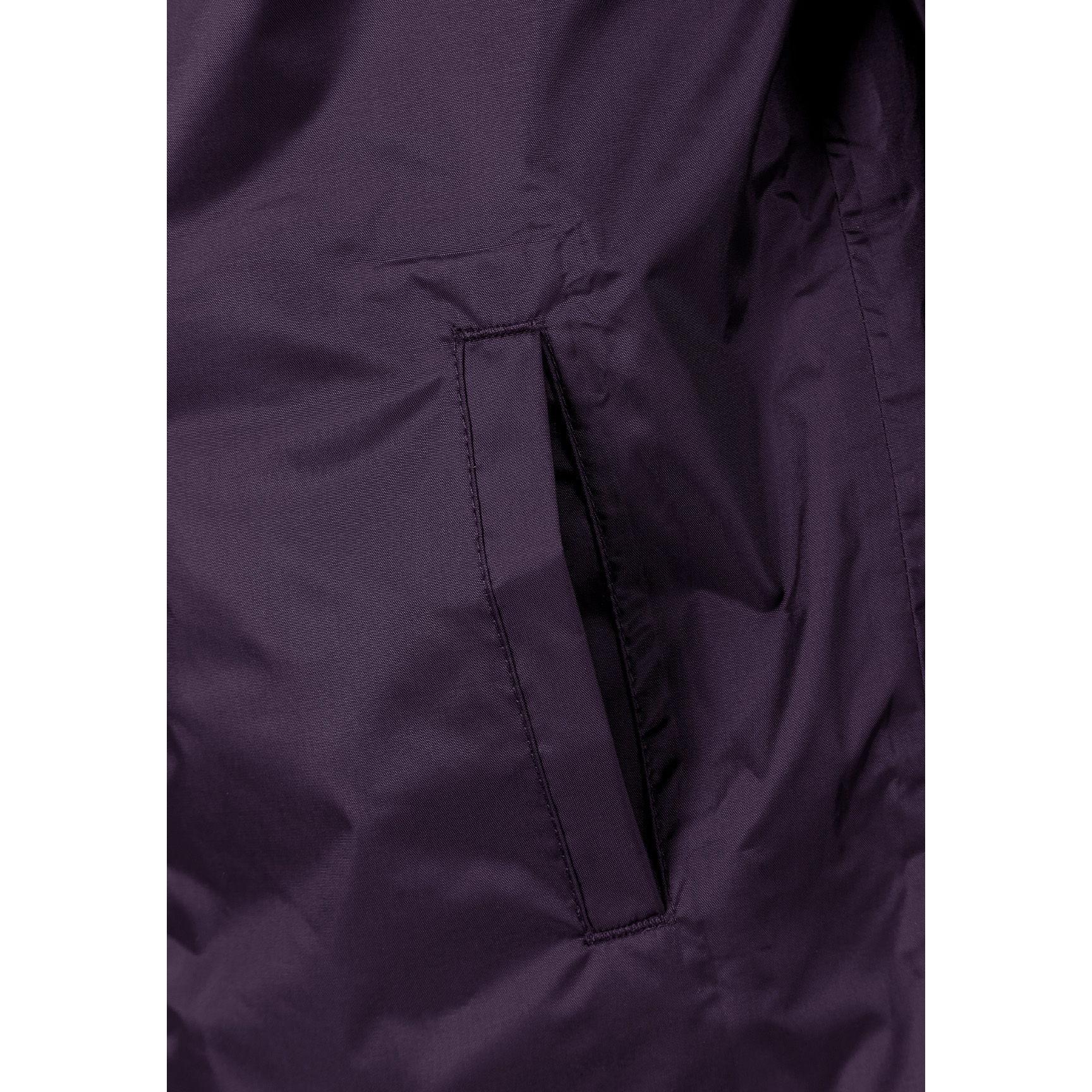 Interior view of purple waterproof jacket showing internal pocket with zipper closure in matching purple fabric