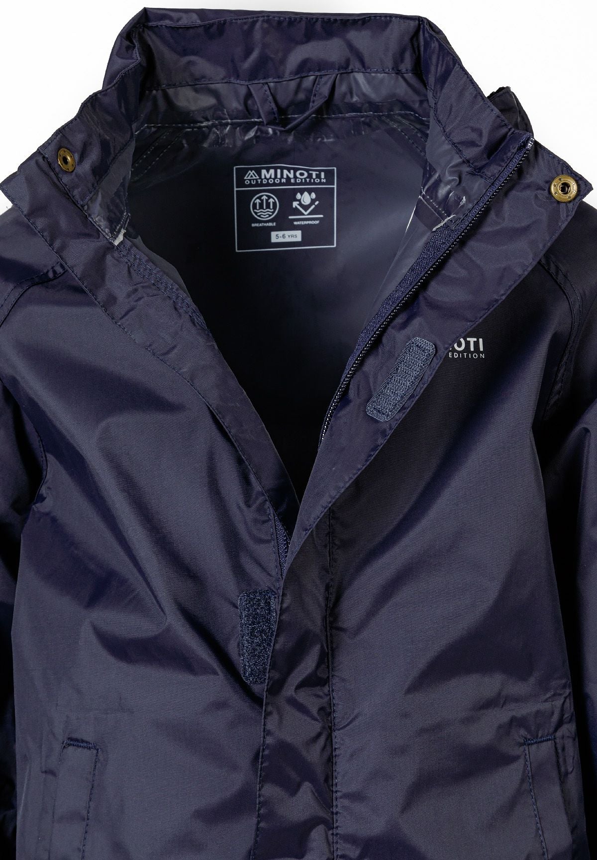 Close-up of the fastening on the navy packaway hooded jacket.