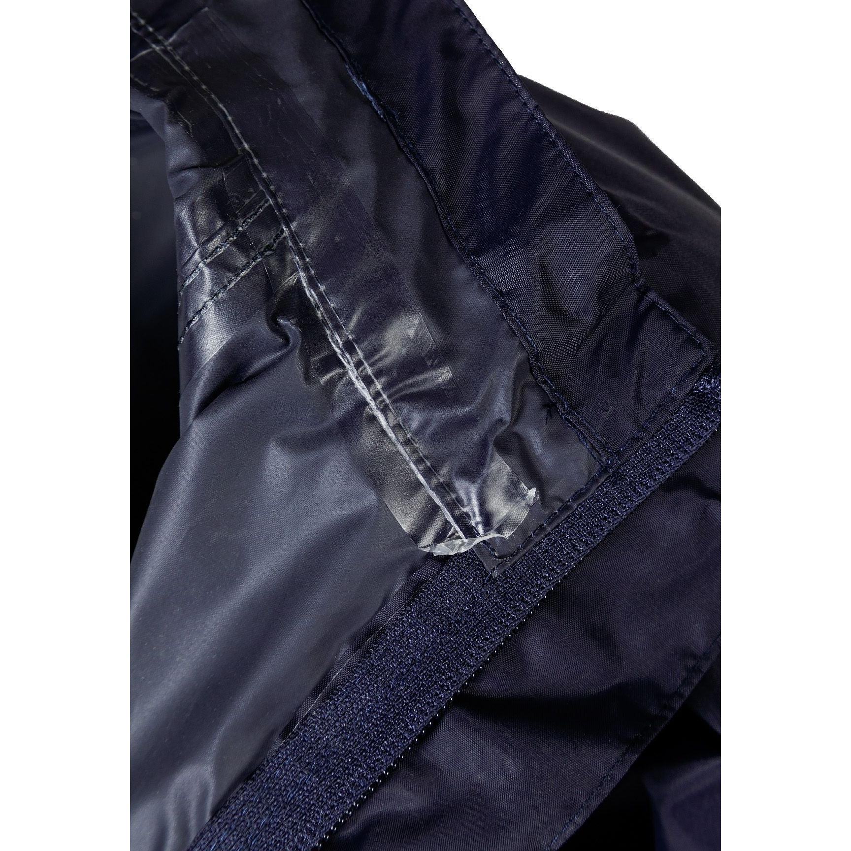 Interior detail view showing navy lining with internal pocket and zip details of the packaway waterproof jacket