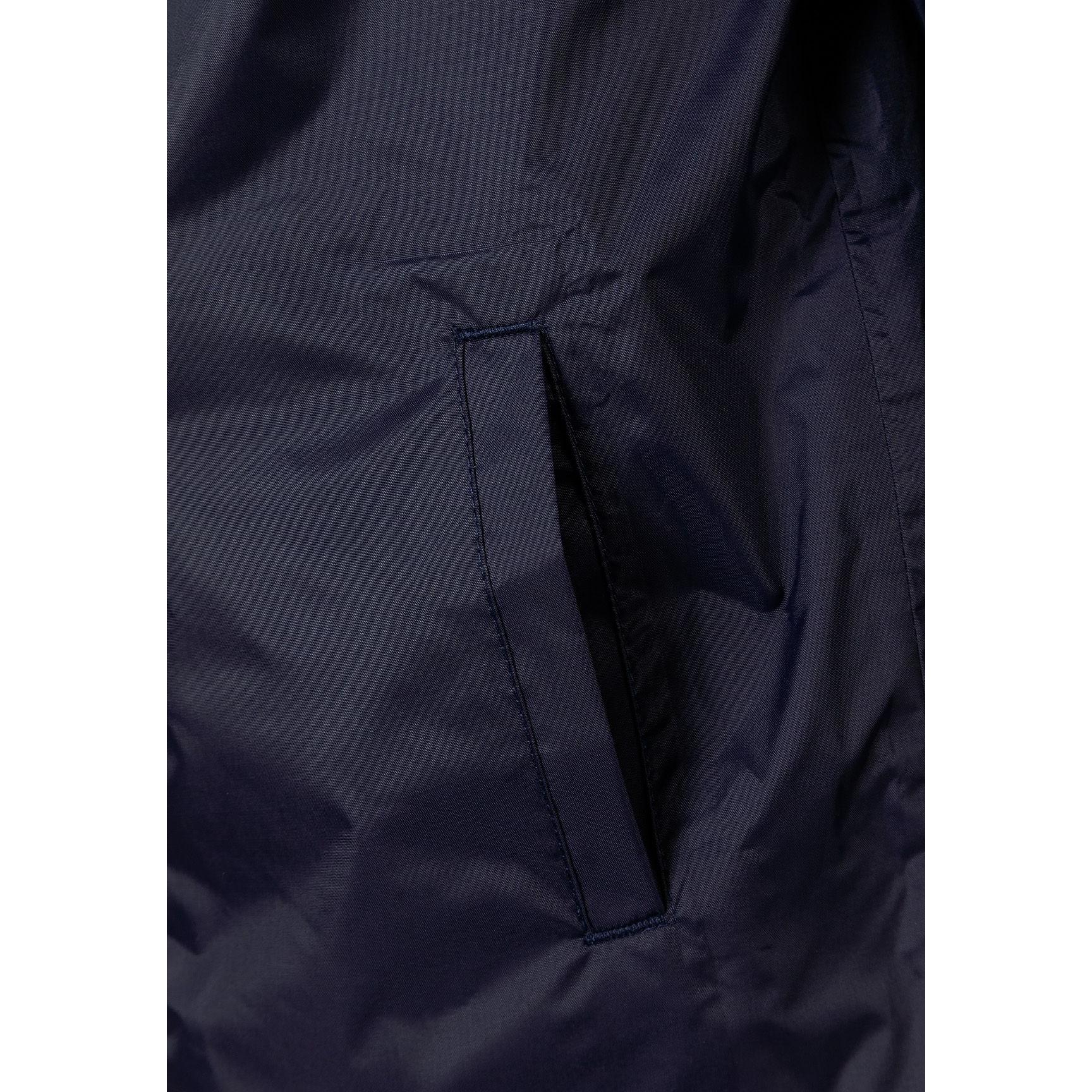 Interior detail view showing navy lining with internal pocket and zip details of the packaway waterproof jacket