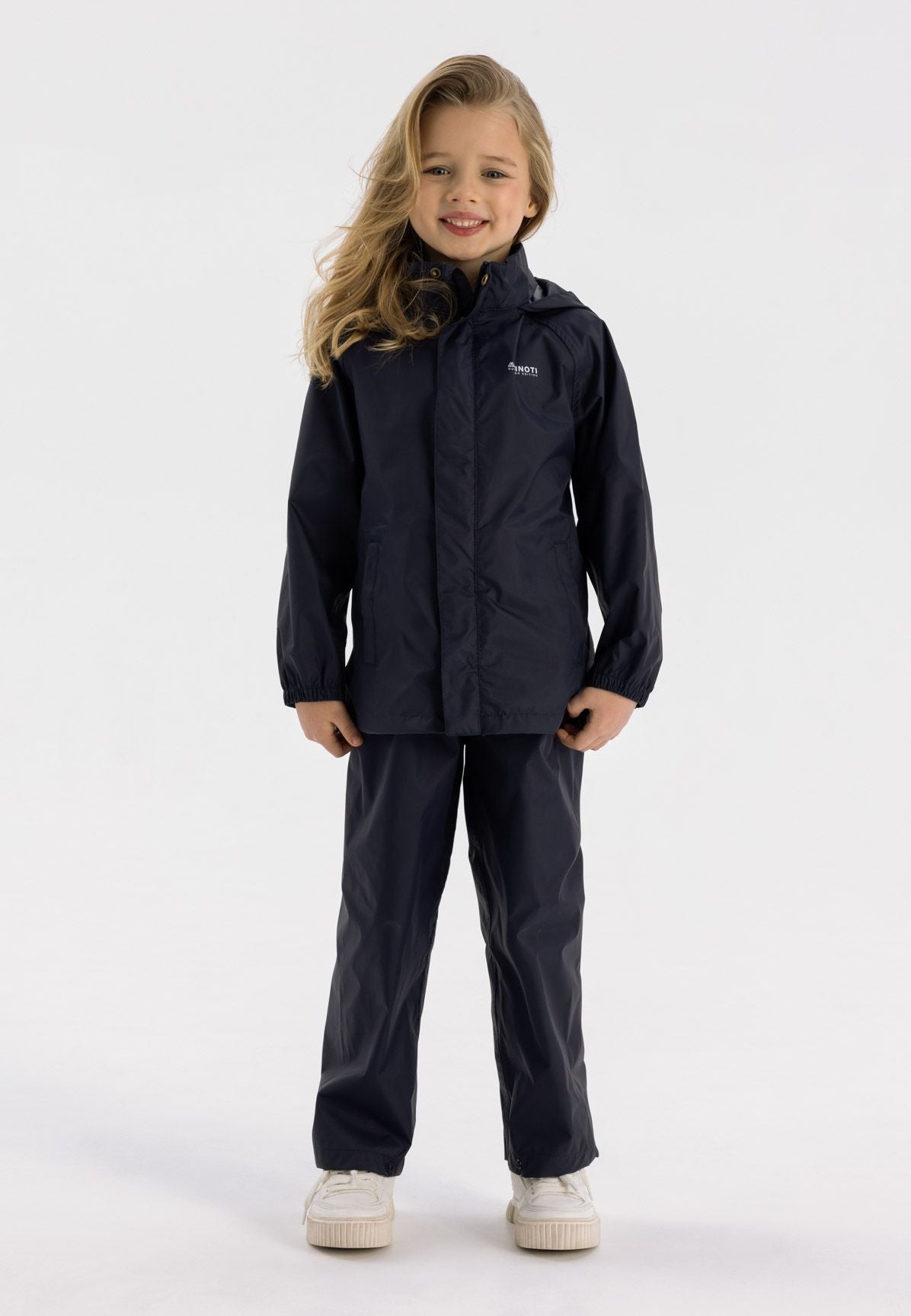 Kids waterproof overpants in navy, front view, featuring elasticated waist and ankle cuffs.