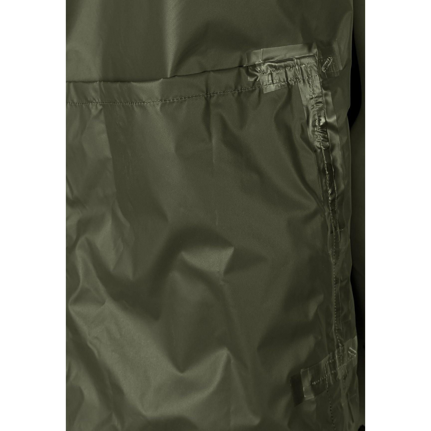 Close-up detail of khaki jacket side showing zip pocket with branded zipper pull and seam construction against white background