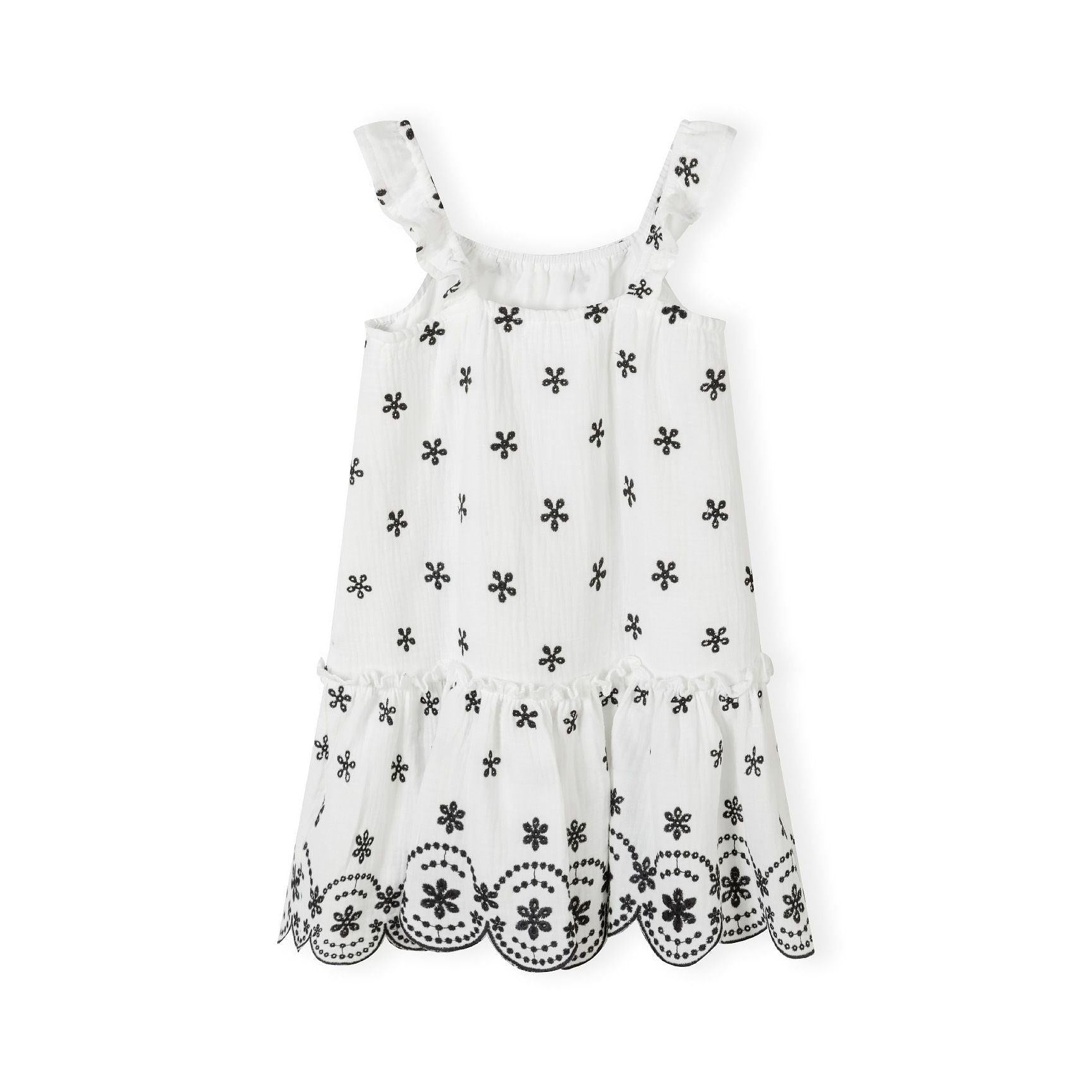 Flat lay of cream cotton muslin dress showing embroidered shoulder straps and all-over floral print pattern on white background