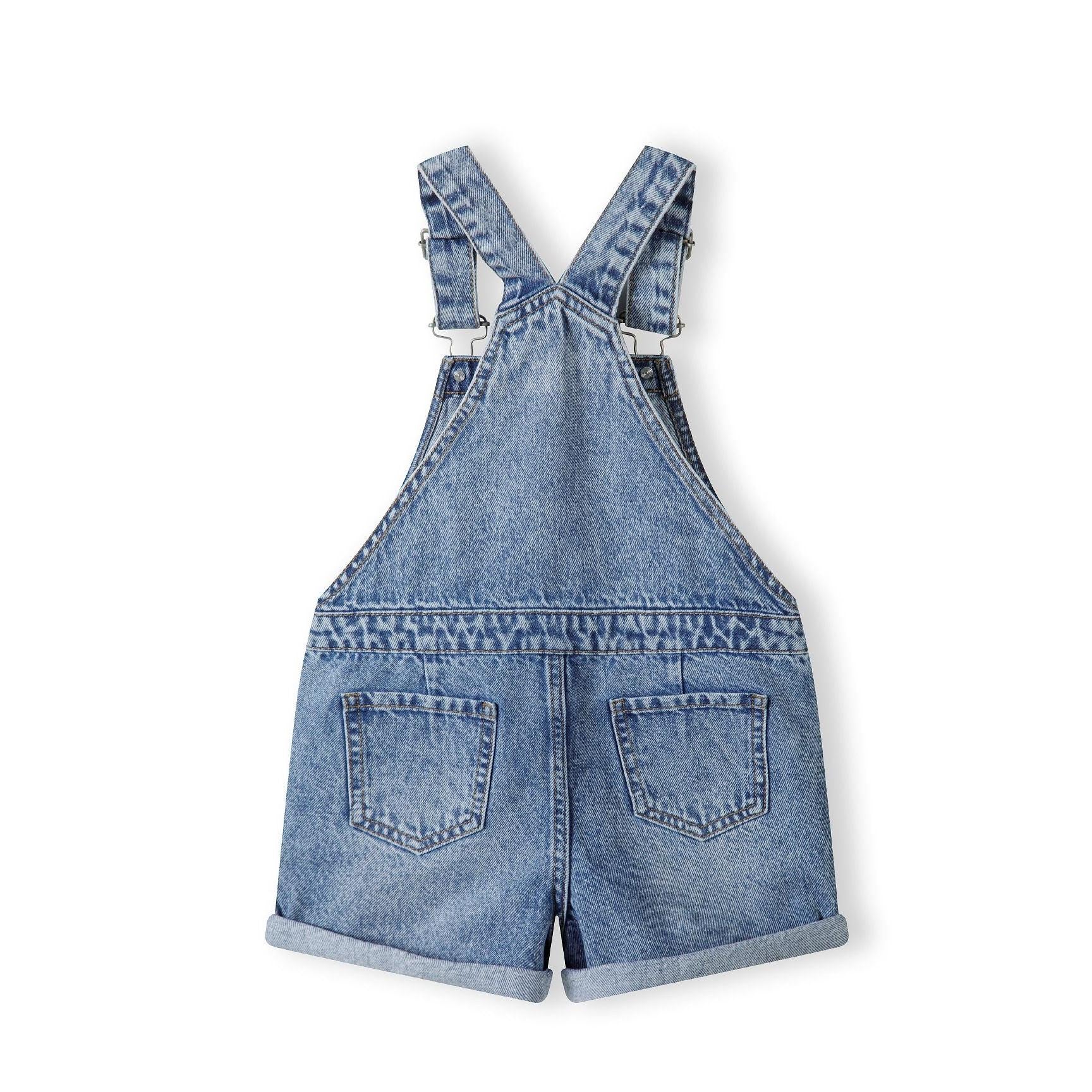 Back view of navy denim short dungarees showing adjustable braces, rear pockets and rolled hem details on white background