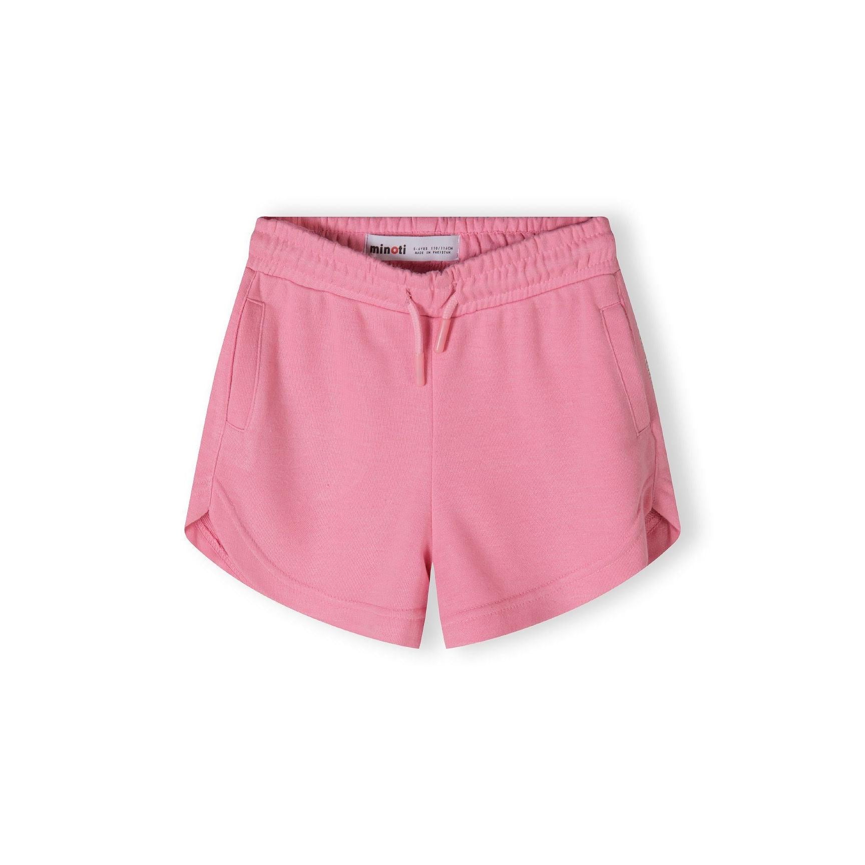 Close-up detail of pink shorts showing side pocket with 'Paris TeamGirl' text printed along the seam