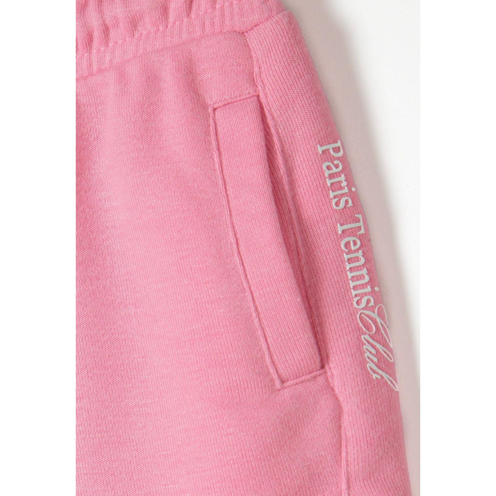 Close-up detail of pink shorts showing side pocket with 'Paris TeamGirl' text printed along the seam