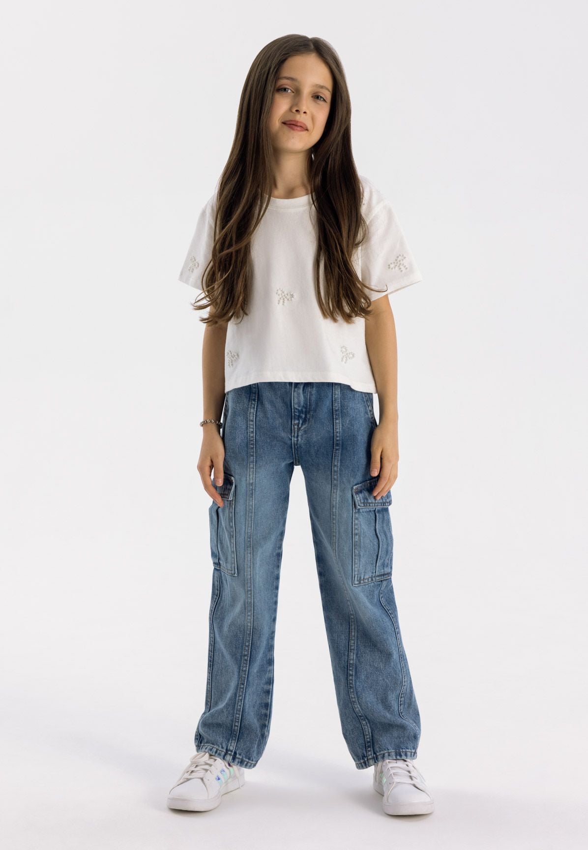 Blue cargo jeans, model front.