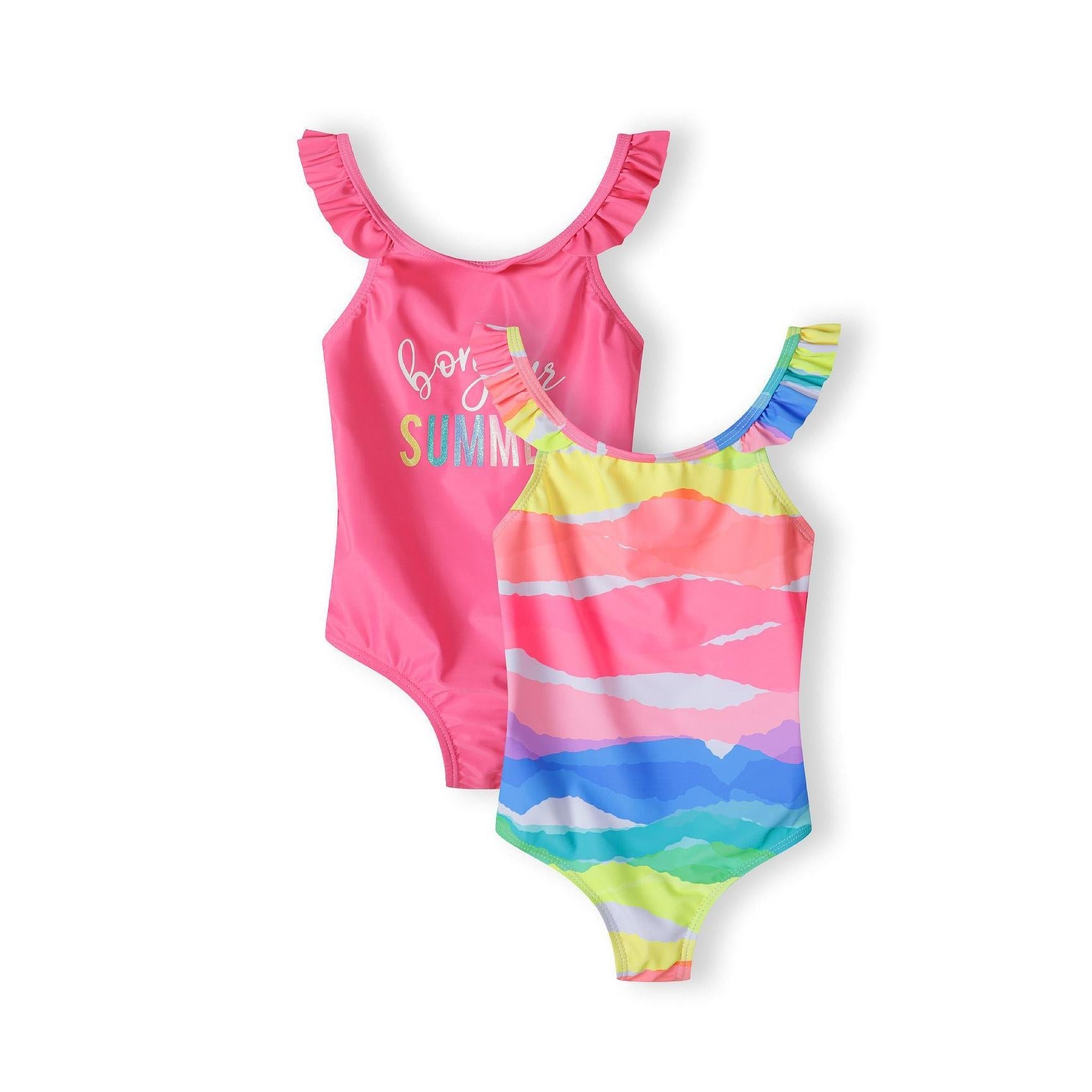 Two girls swimsuits displayed on white background - one bright pink with 'Bonjour Summer' text and ruffle straps, one rainbow striped with colorful horizontal bands