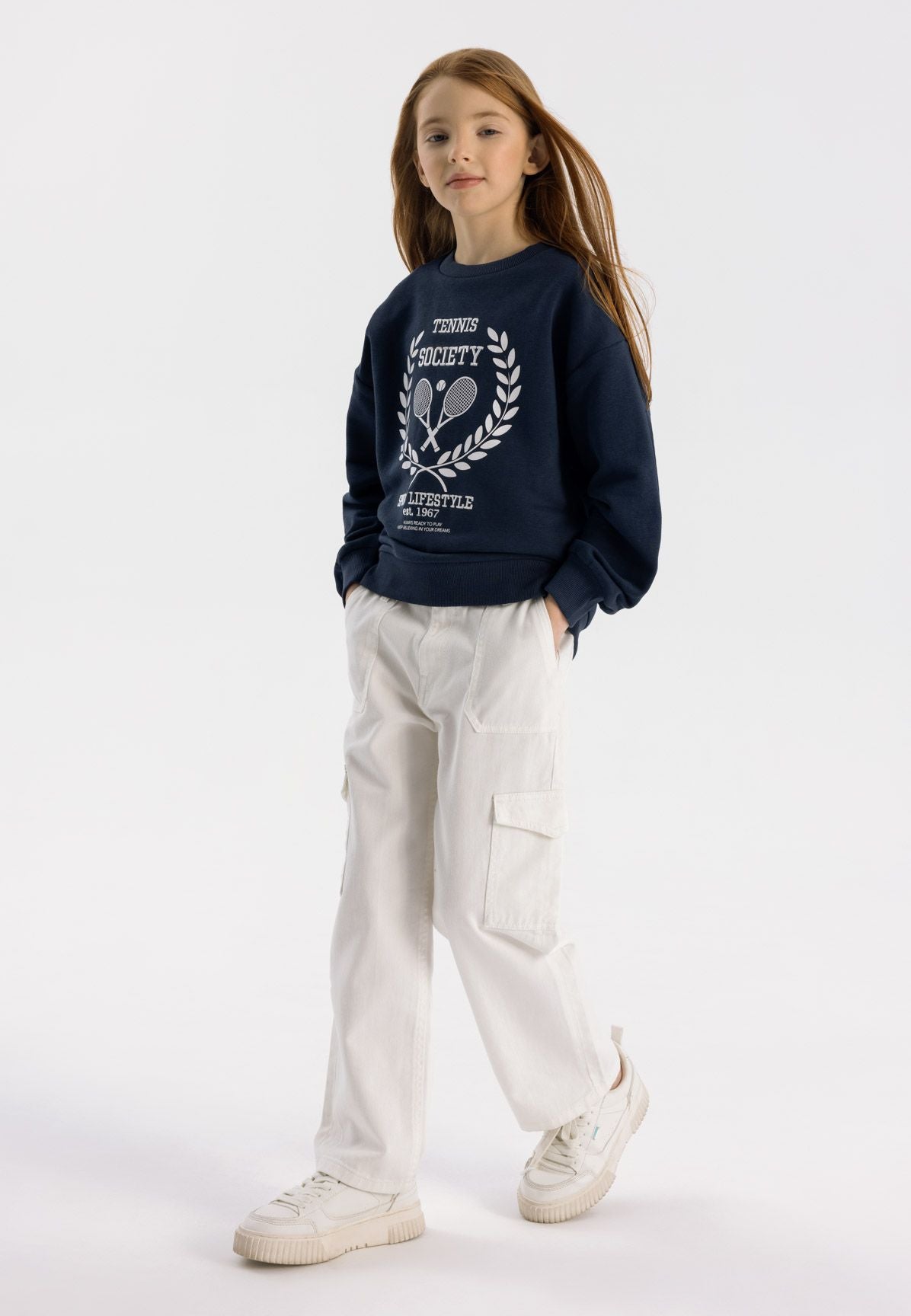 Girls wide leg cargo trousers in white, featuring cargo pockets and an adjustable waistband.