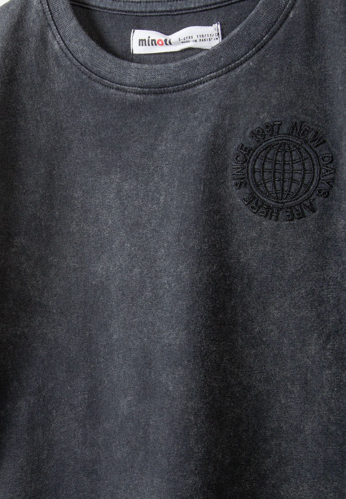 Detail of a grey short sleeve t-shirt with a round neckline and printed logo.