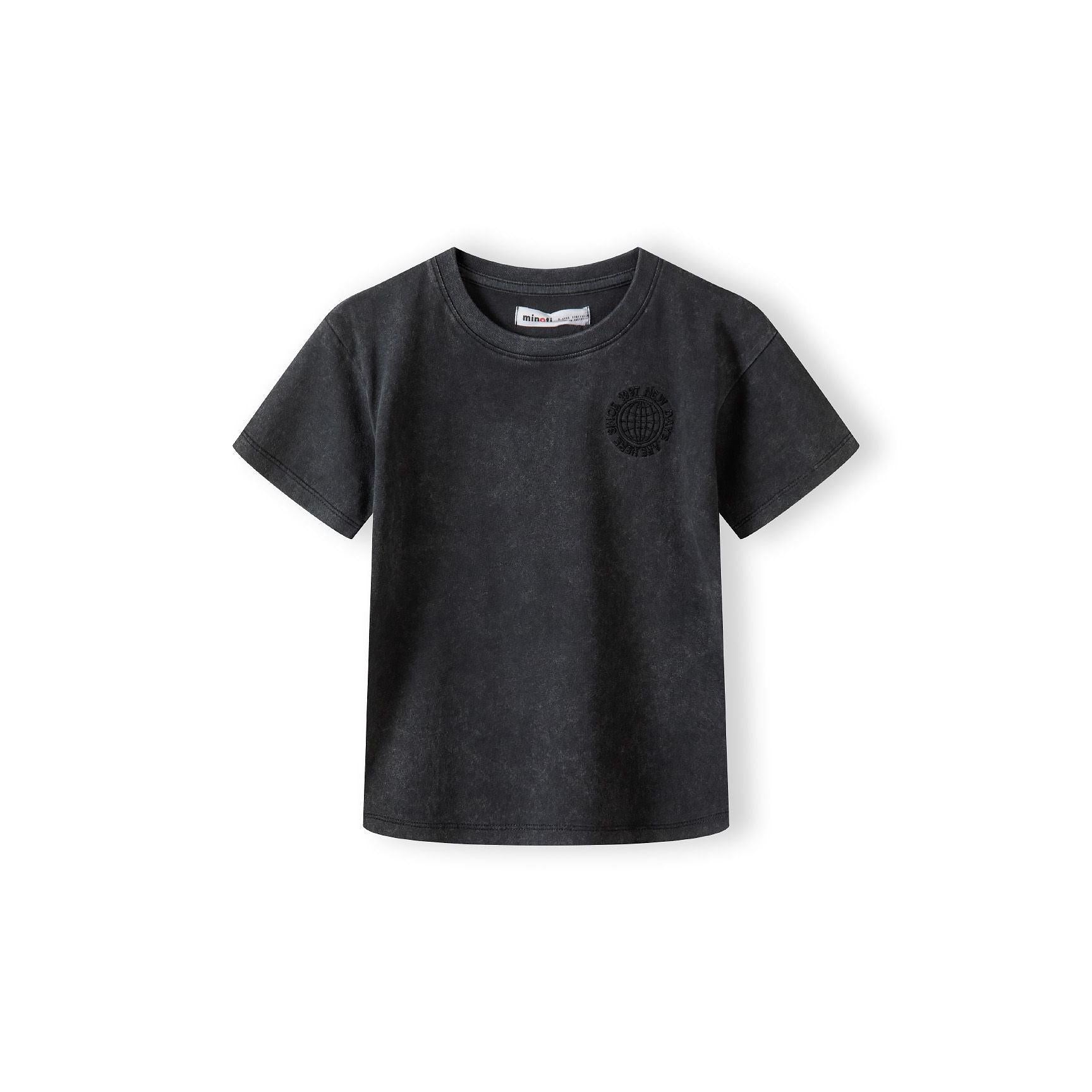 Close-up detail of washed grey fleece shorts showing elasticated waistband with white label and soft fabric texture