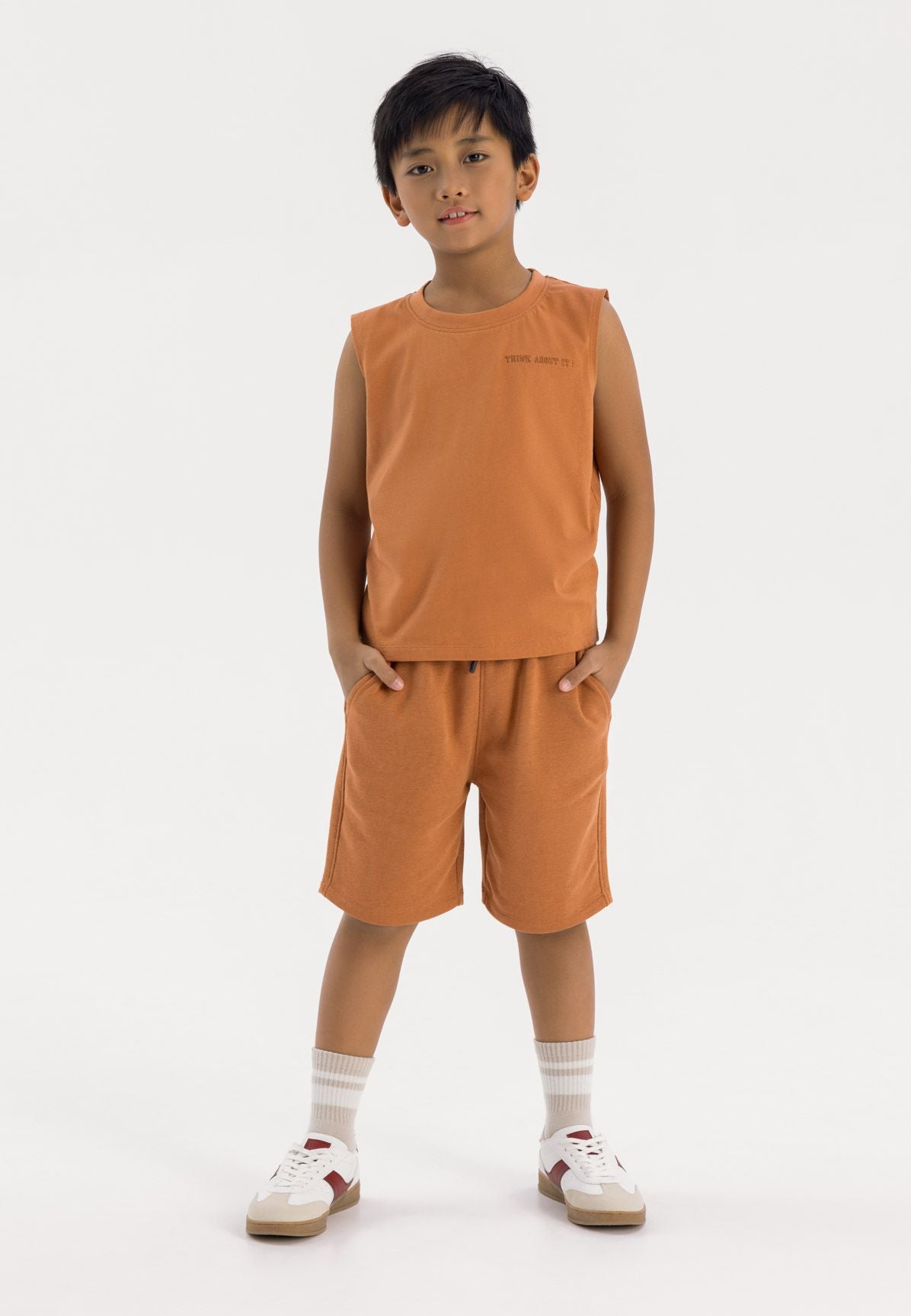 Boys sleeveless vest and shorts set in orange with side pockets, front view.