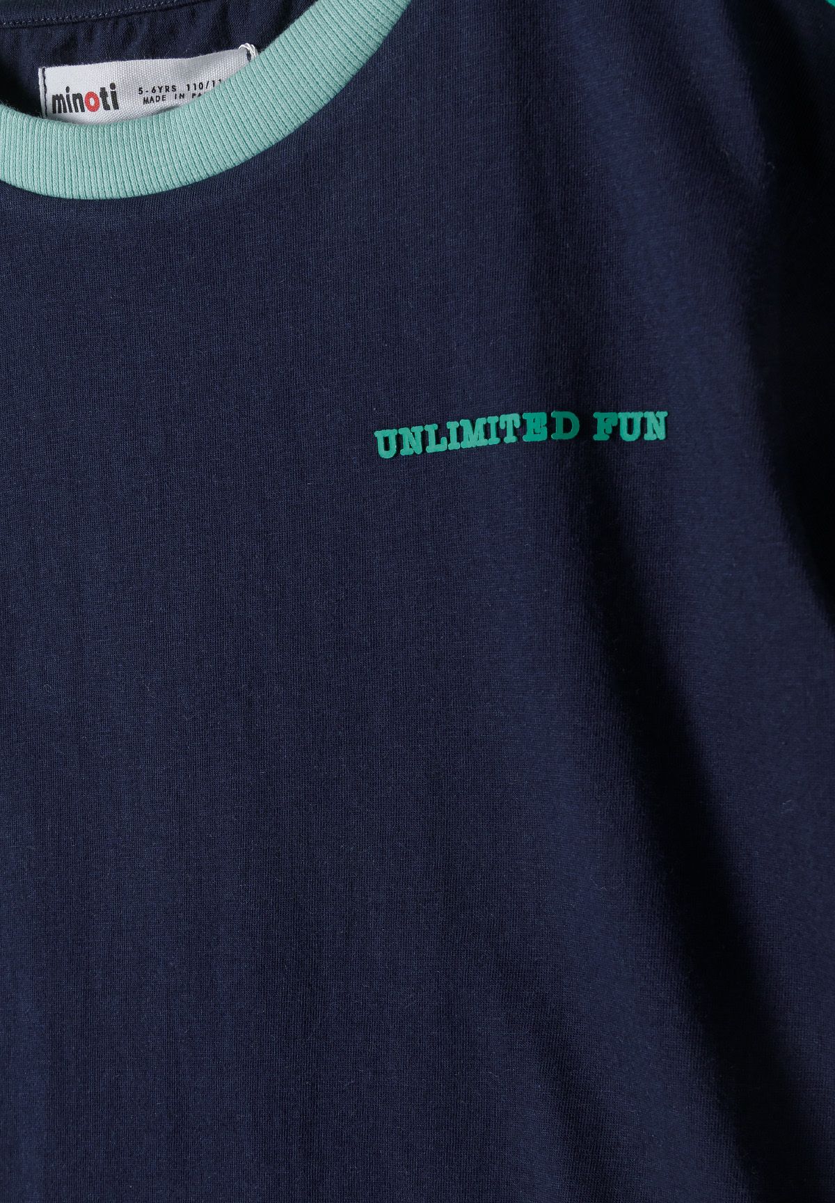 Close-up of boys short sleeve t-shirt in navy with 'UNLIMITED FUN' print.