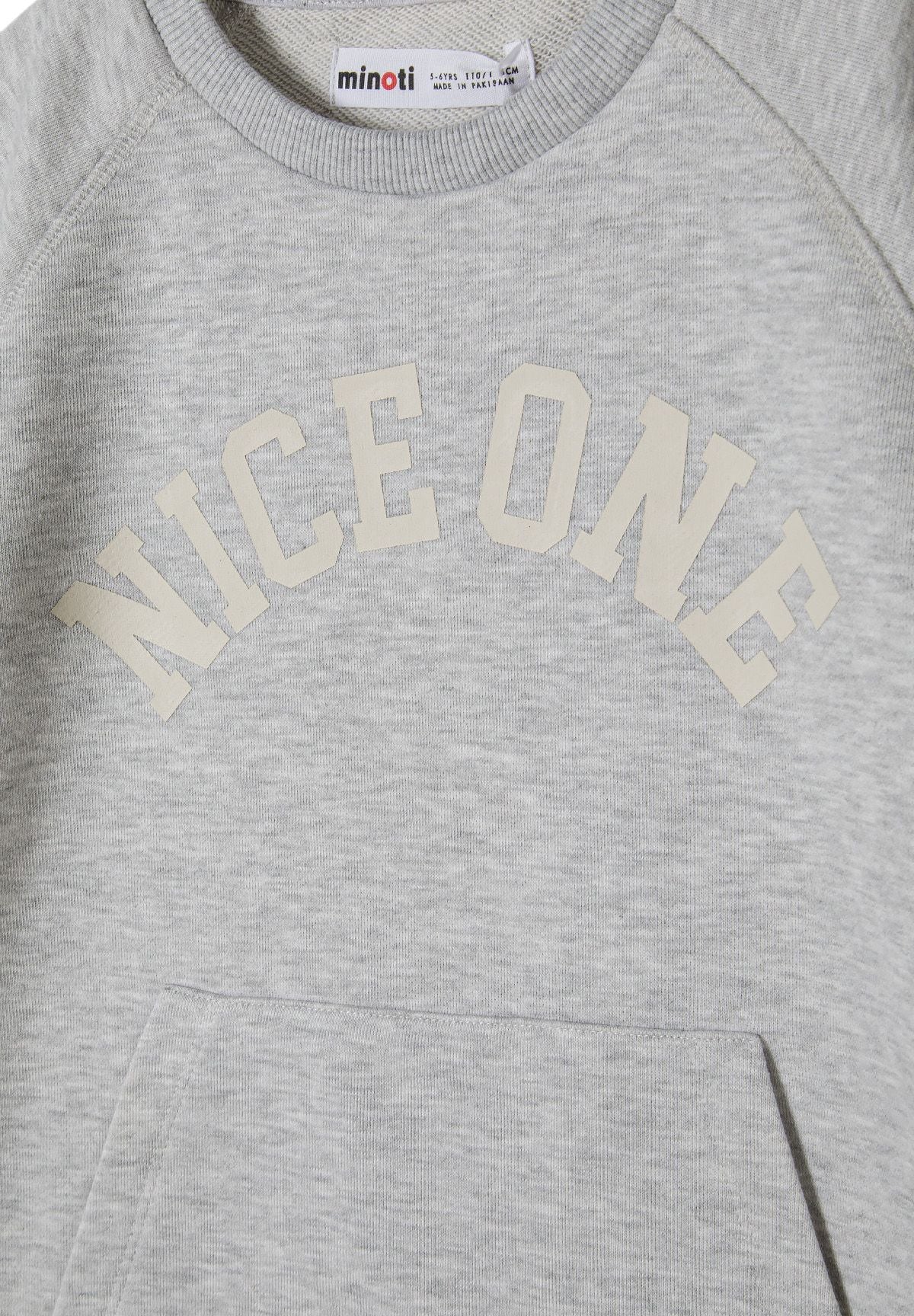 Detail of grey t-shirt with raglan sleeves and 'NICE ONE' print.