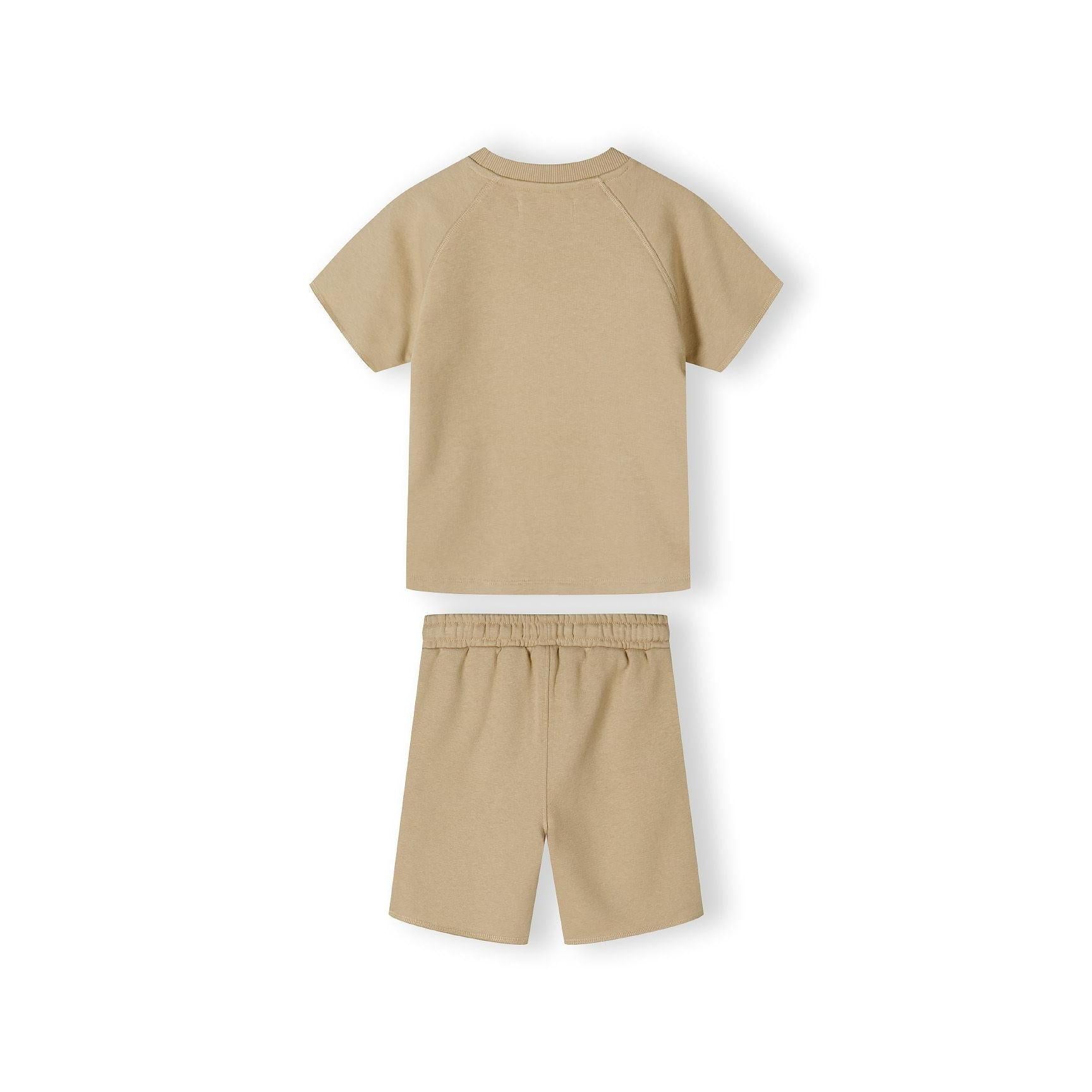Close-up detail of beige fleece shorts waistband showing elasticated band with woven drawstring tie