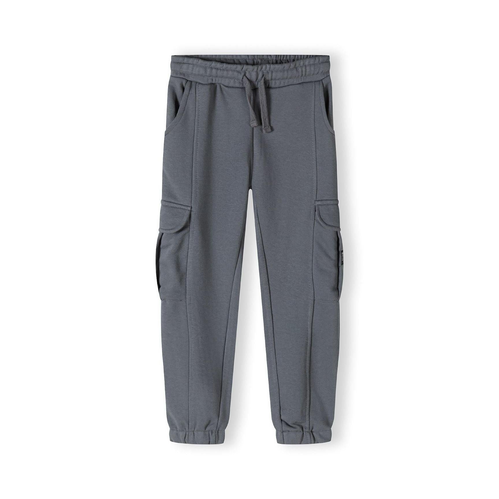 Flat lay view of grey cargo joggers showing side pockets, elasticated waistband and cuffs, full length product shot on white background