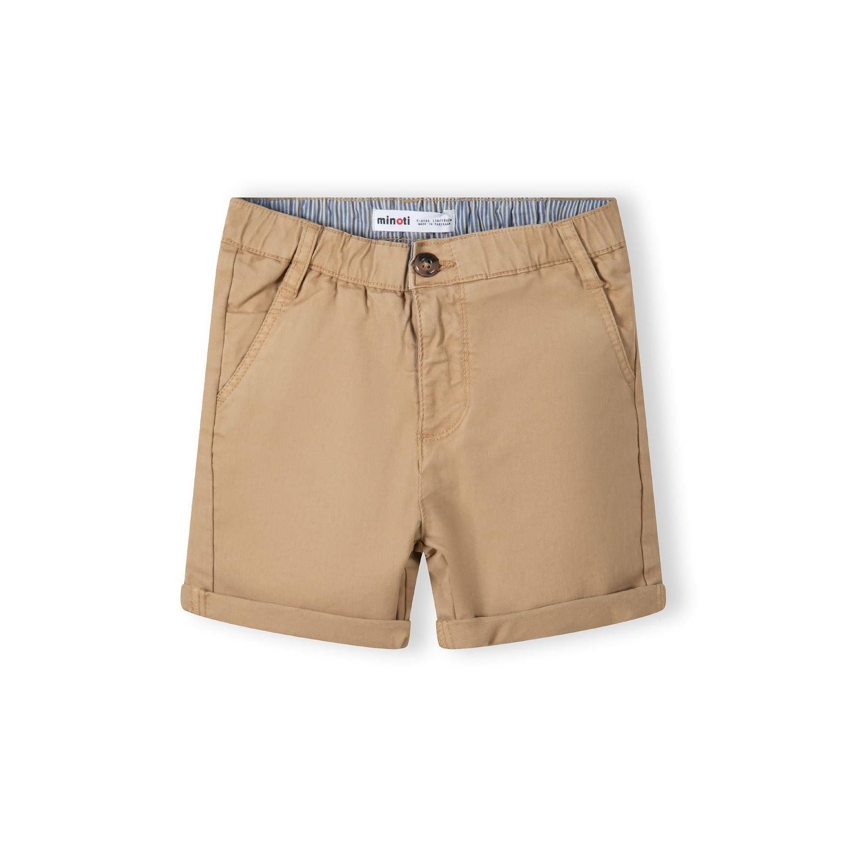 Close-up detail of stone beige chino shorts showing Minoti label, button closure and pocket construction