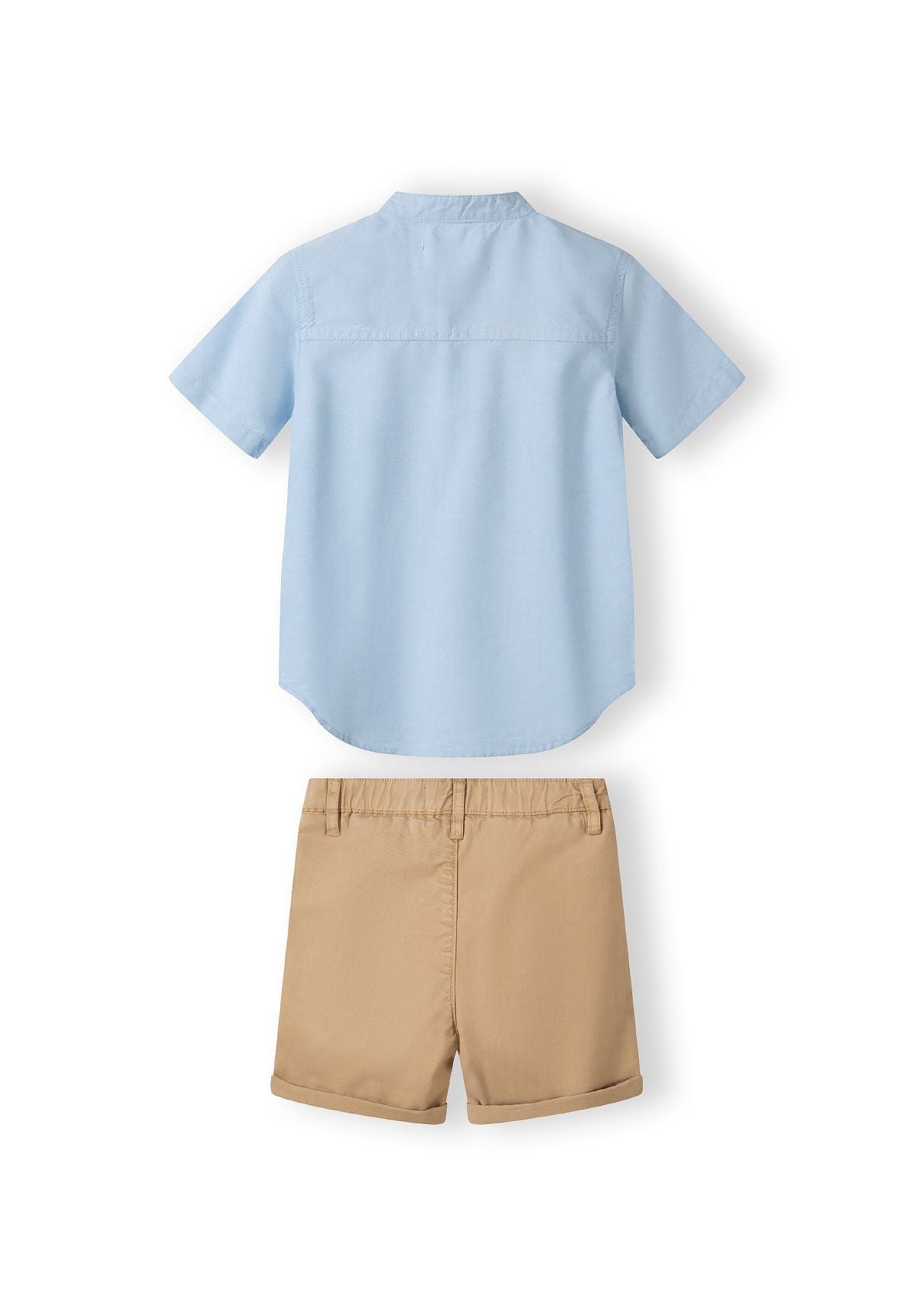 Boys grandad shirt in light blue with button fastening and beige shorts with adjustable waistband.