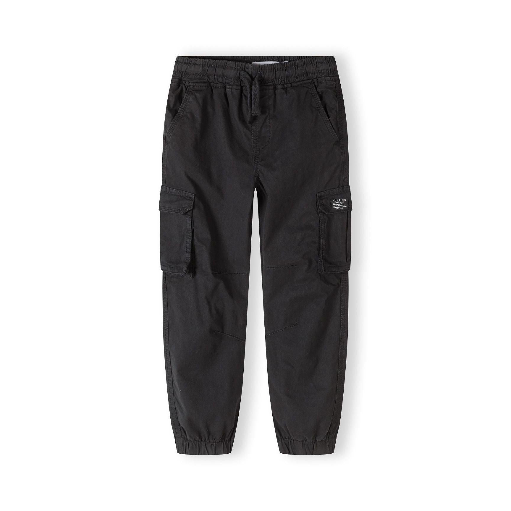 Back view of black cargo trousers showing elasticated waistband, cargo pockets on sides and tapered leg shape on white background
