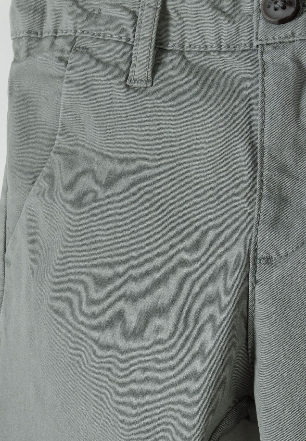 Detail of boys grey chino trousers with adjustable waistband and flat front.