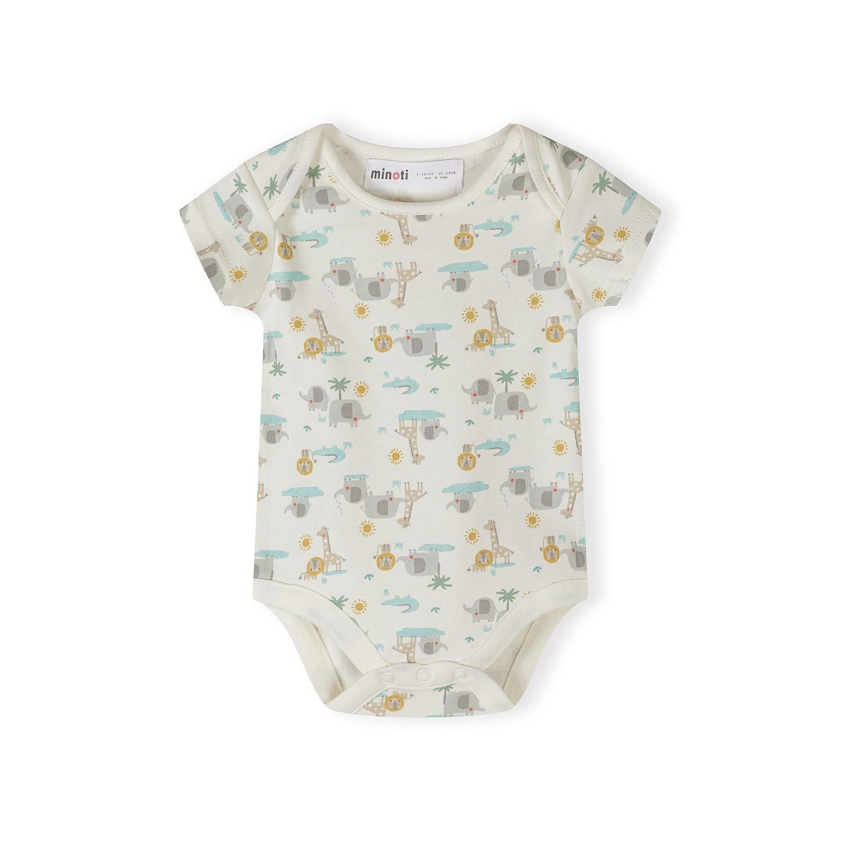 Close-up detail of cream bodysuit with colorful polka dots and safari print showing elephant, giraffe, lion, palm tree and 'Hello jungle FRIENDS' text with sun design