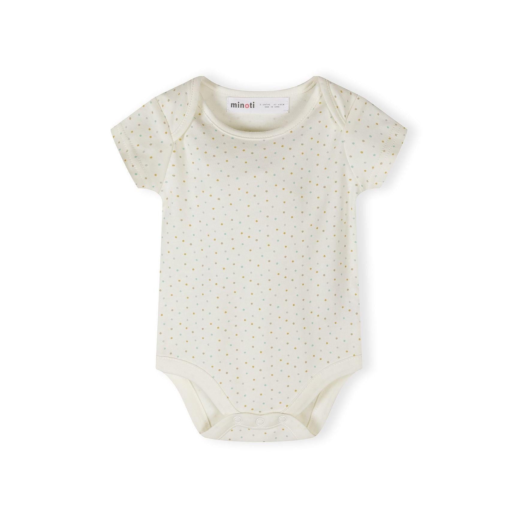 Close-up detail of cream bodysuit with colorful polka dots and safari print showing elephant, giraffe, lion, palm tree and 'Hello jungle FRIENDS' text with sun design