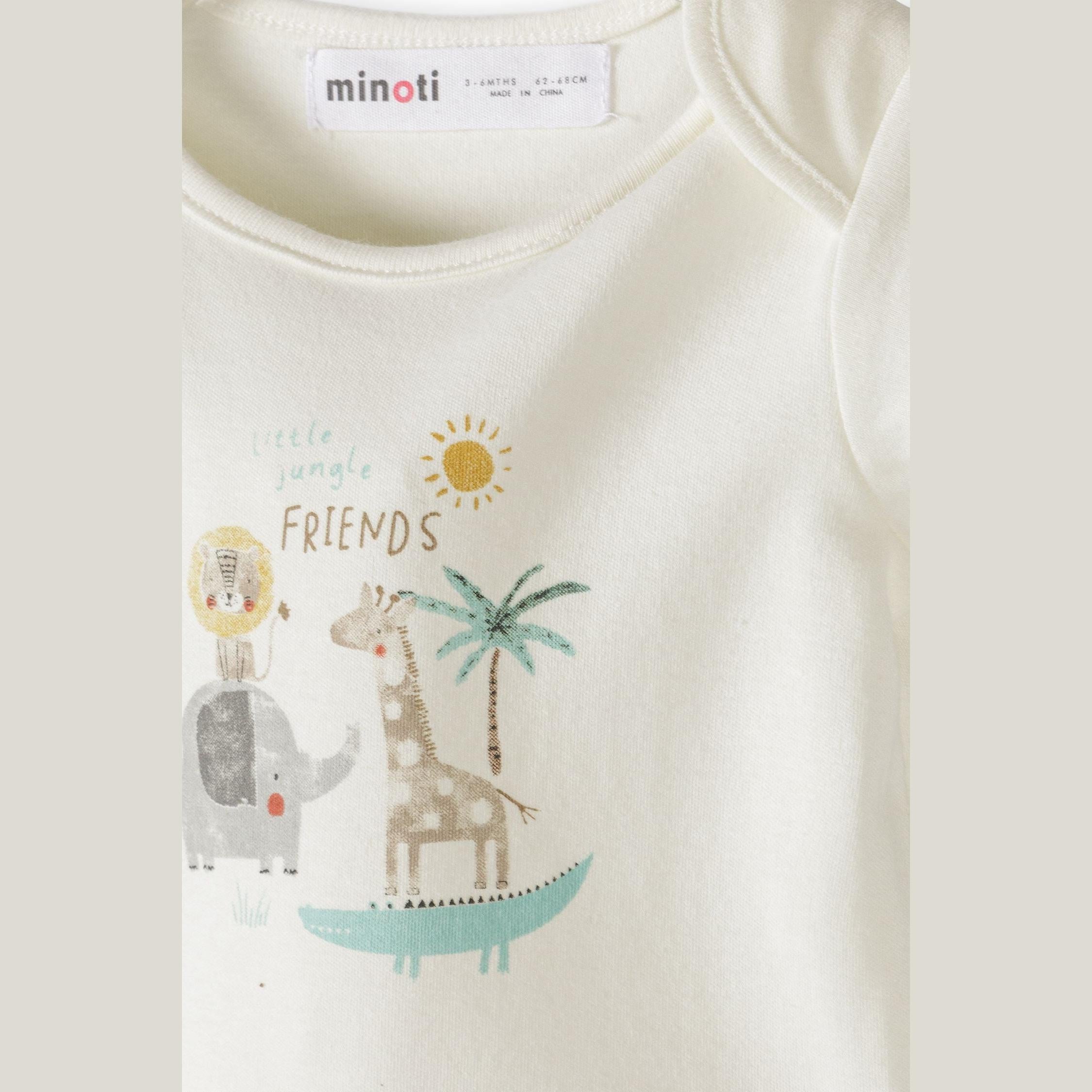 Cream cotton drawstring gift bag with natural cord ties and small wooden star charm on white background