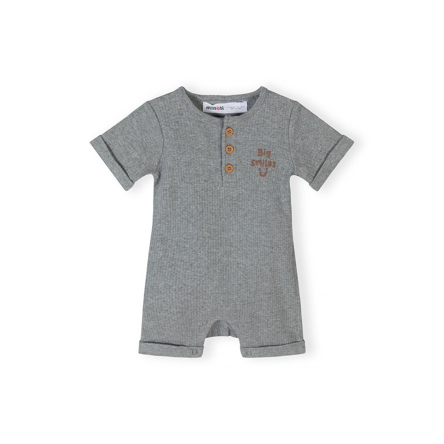 Single beige baby romper with small black dot pattern, short sleeves and three wooden buttons at the neckline, displayed flat against white background