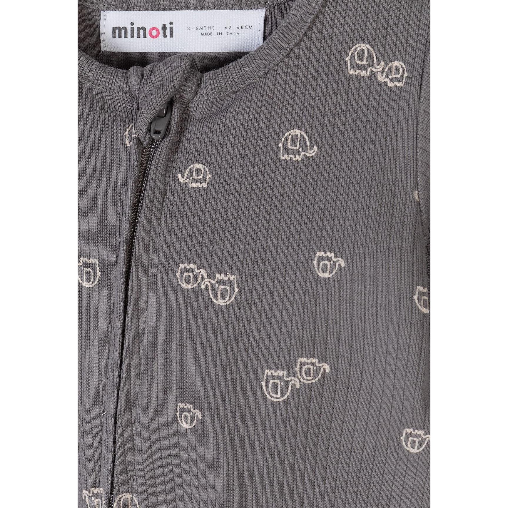 Detail view of grey romper fabric showing ribbed texture and small white elephant motifs scattered across the surface