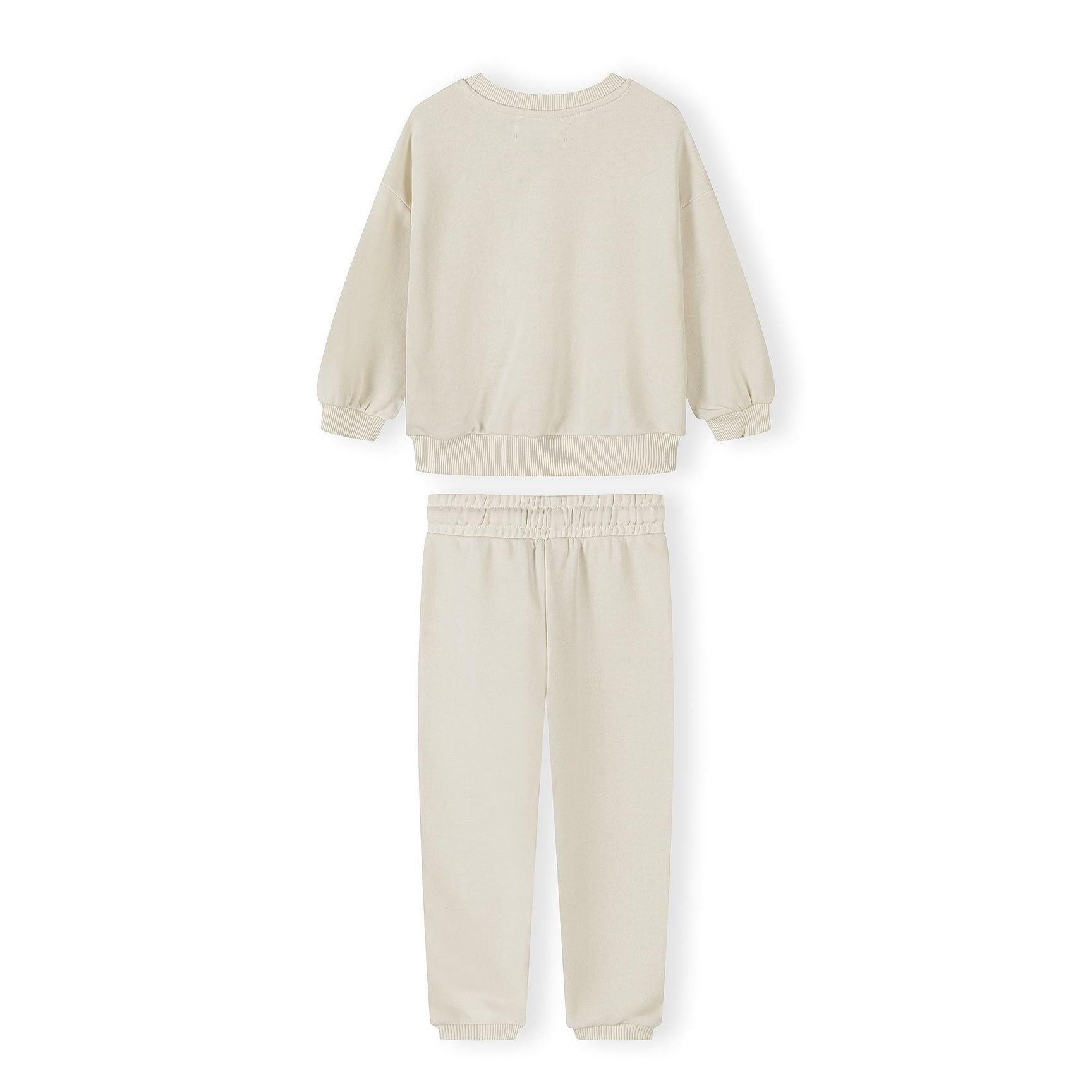 Detail shot of beige sweatshirt showing Minoti label at neckline and small embroidered logo on chest area