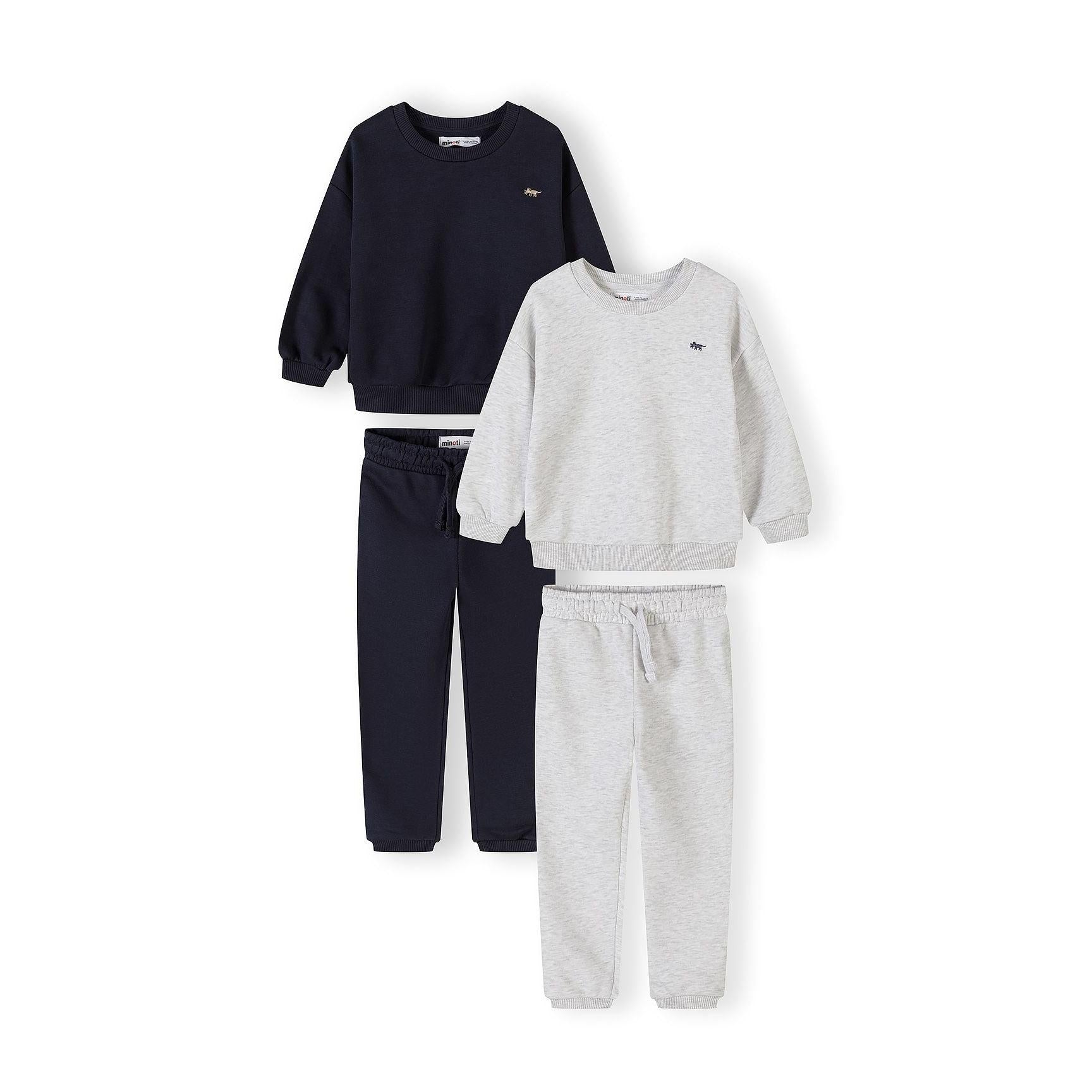 Four piece tracksuit set laid flat showing navy sweatshirt, grey sweatshirt, navy joggers and grey joggers on white background