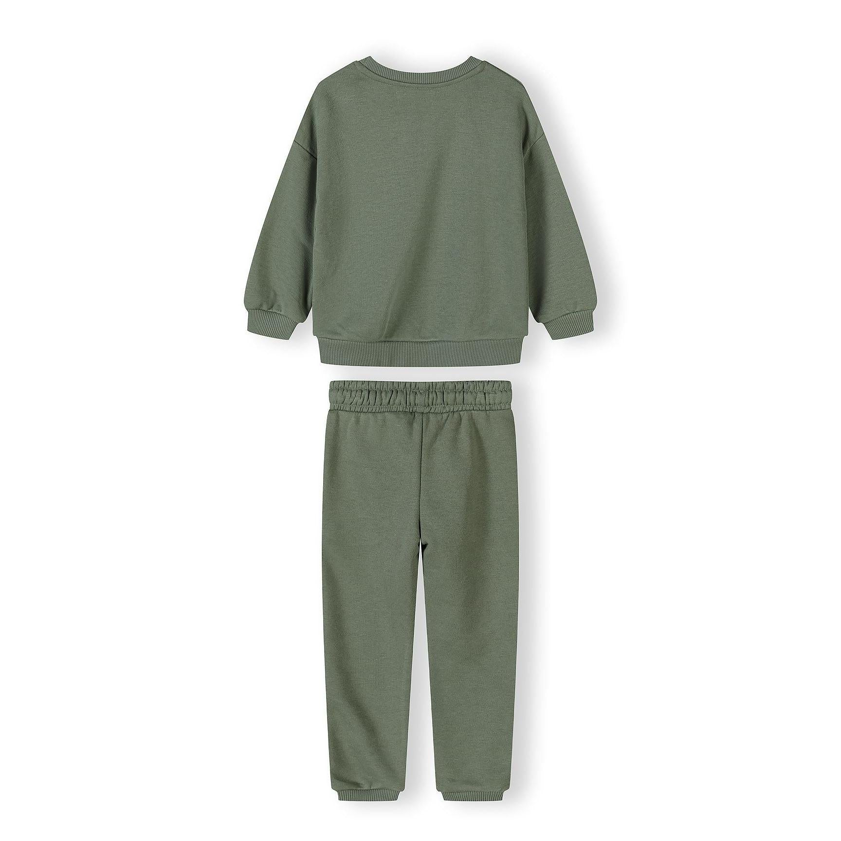 Close-up detail of olive green joggers showing elastic waistband with drawstring ties for comfortable fit