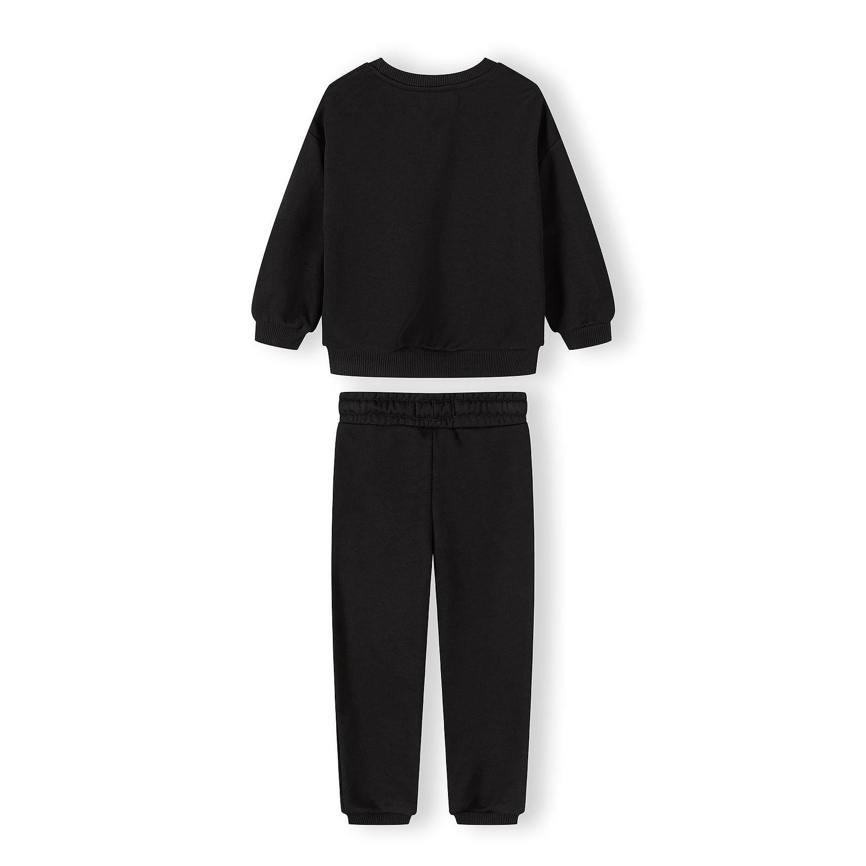 Close-up detail of olive green joggers showing elastic waistband with drawstring ties for comfortable fit