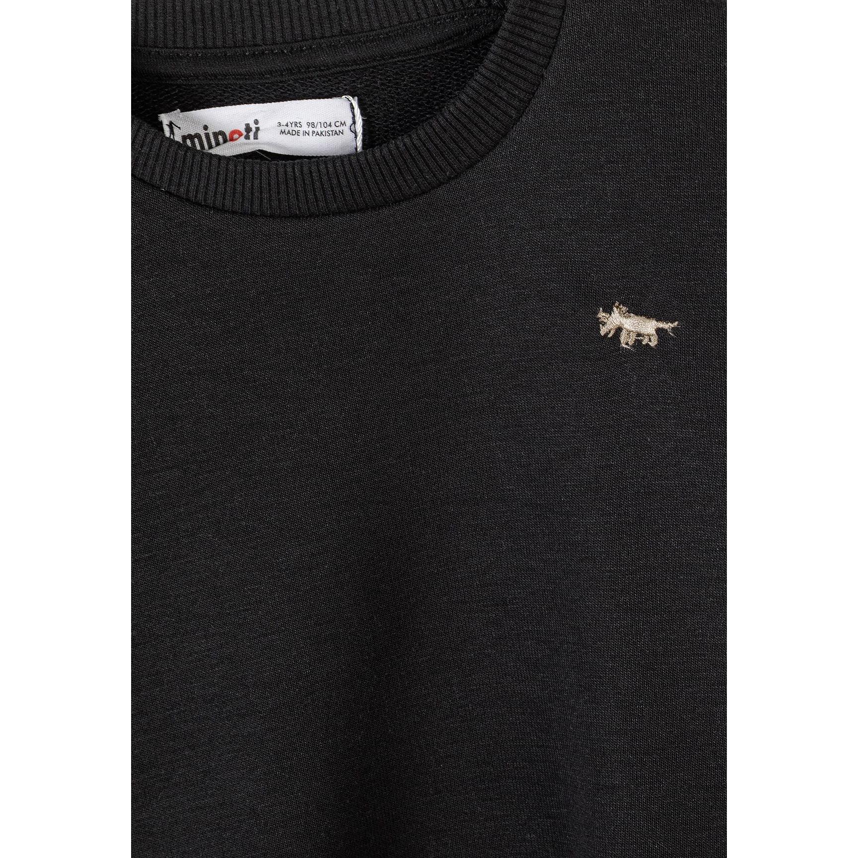 Close-up detail of olive green joggers showing elastic waistband with drawstring ties for comfortable fit