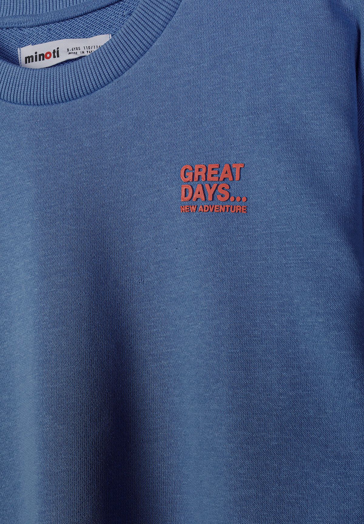 Close-up of blue sweatshirt with rust GREAT DAYS NEW ADVENTURE chest print.