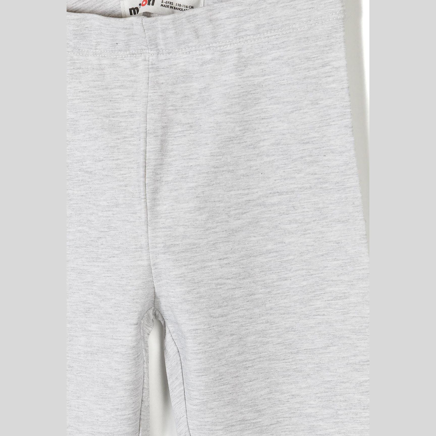 Close-up detail of grey marl jersey leggings showing fabric texture and construction with Minoti label at waistband