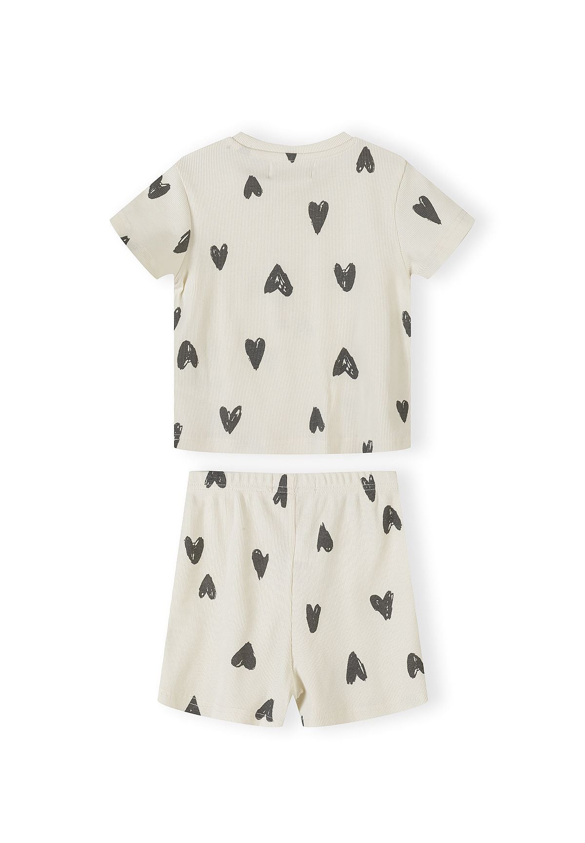 Single cream ribbed pyjama set with black hearts print showing short-sleeved top and matching shorts laid flat on white background