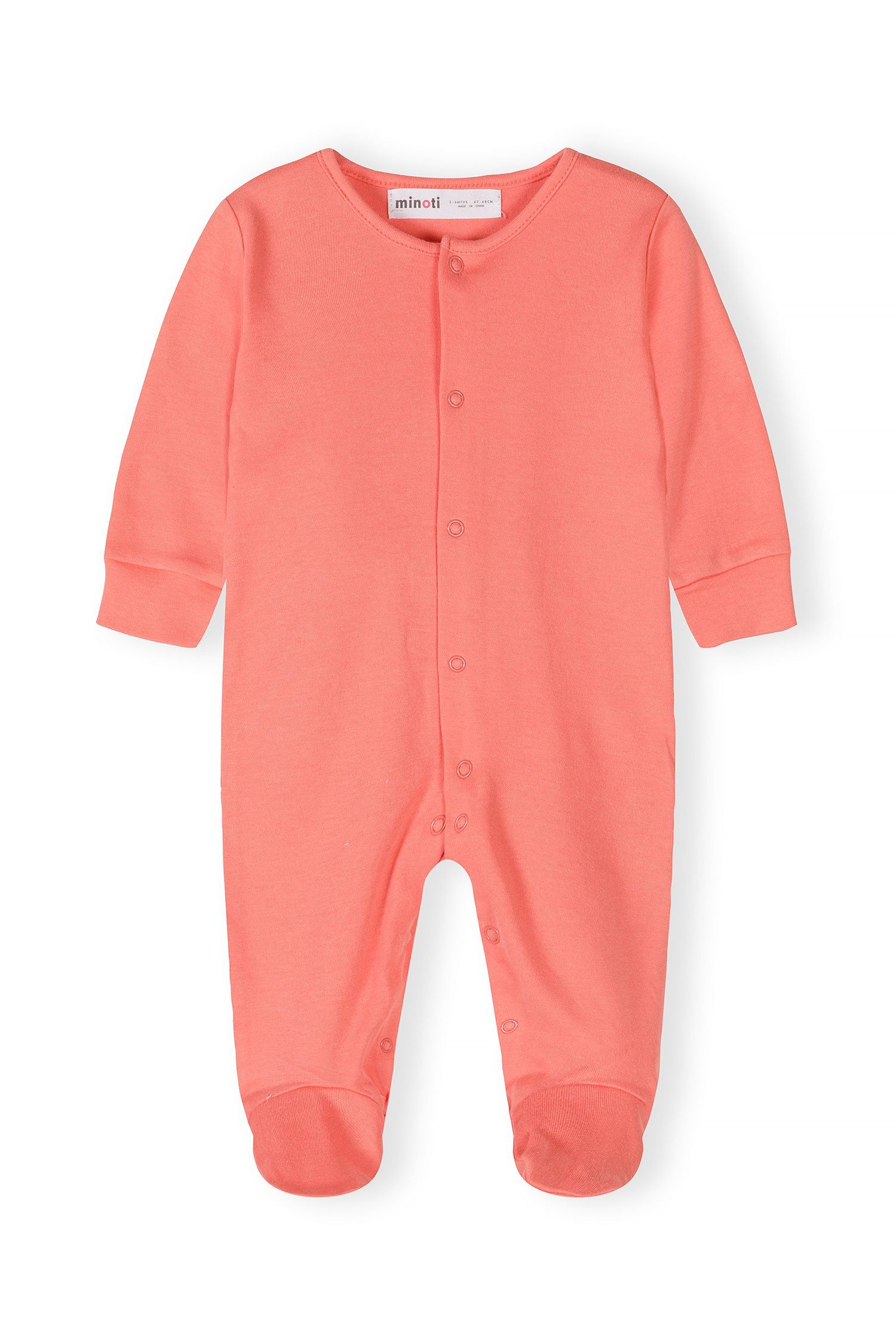 Close-up of a coral long-sleeve sleepsuit with press studs and elasticated cuffs.