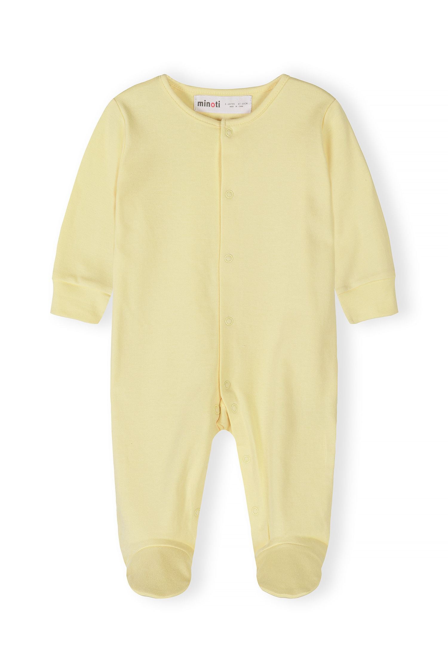Detail of a long-sleeve yellow sleepsuit with press studs and elasticated cuffs.