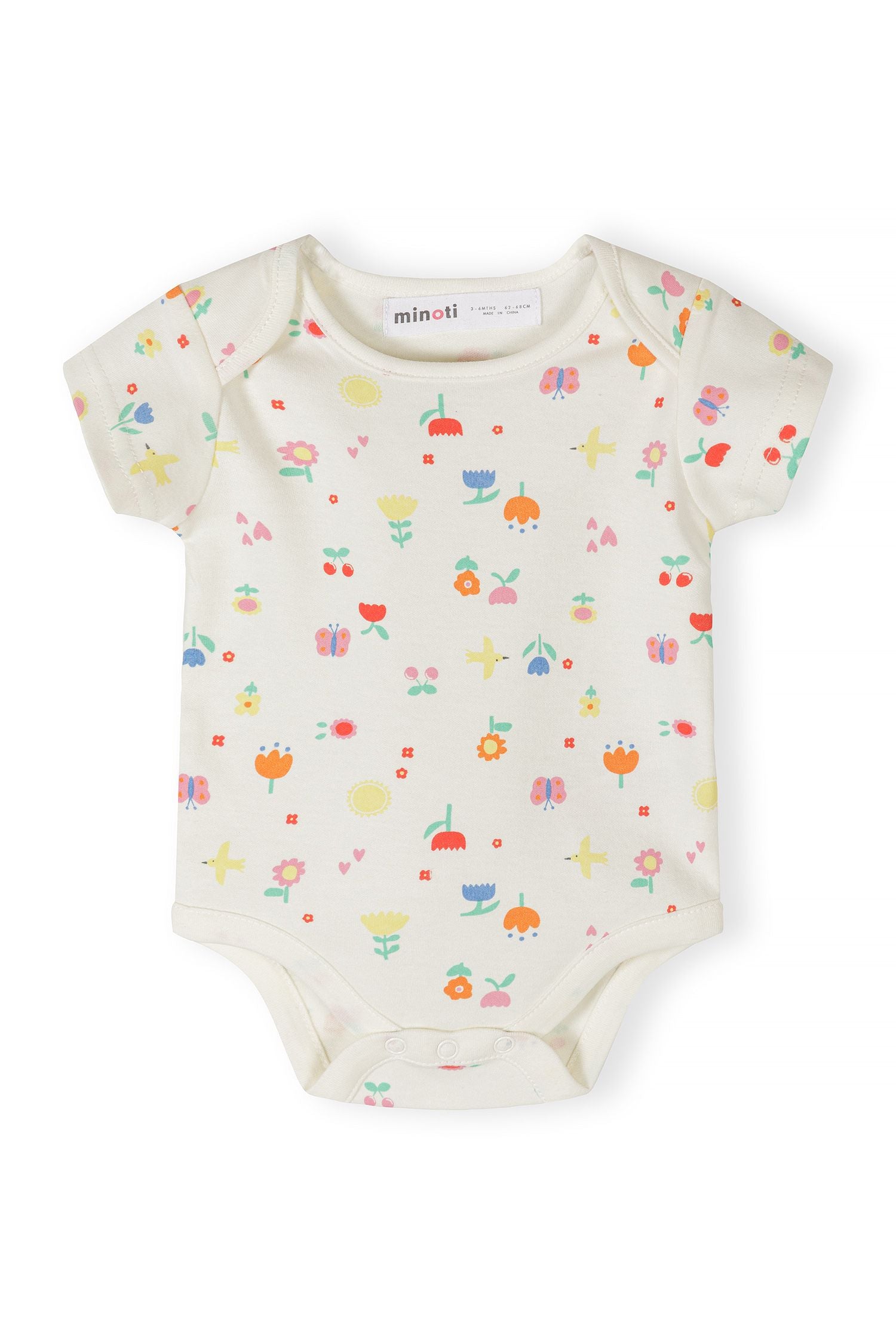 Girls short sleeve bodysuit with colorful floral and spot prints, front view.