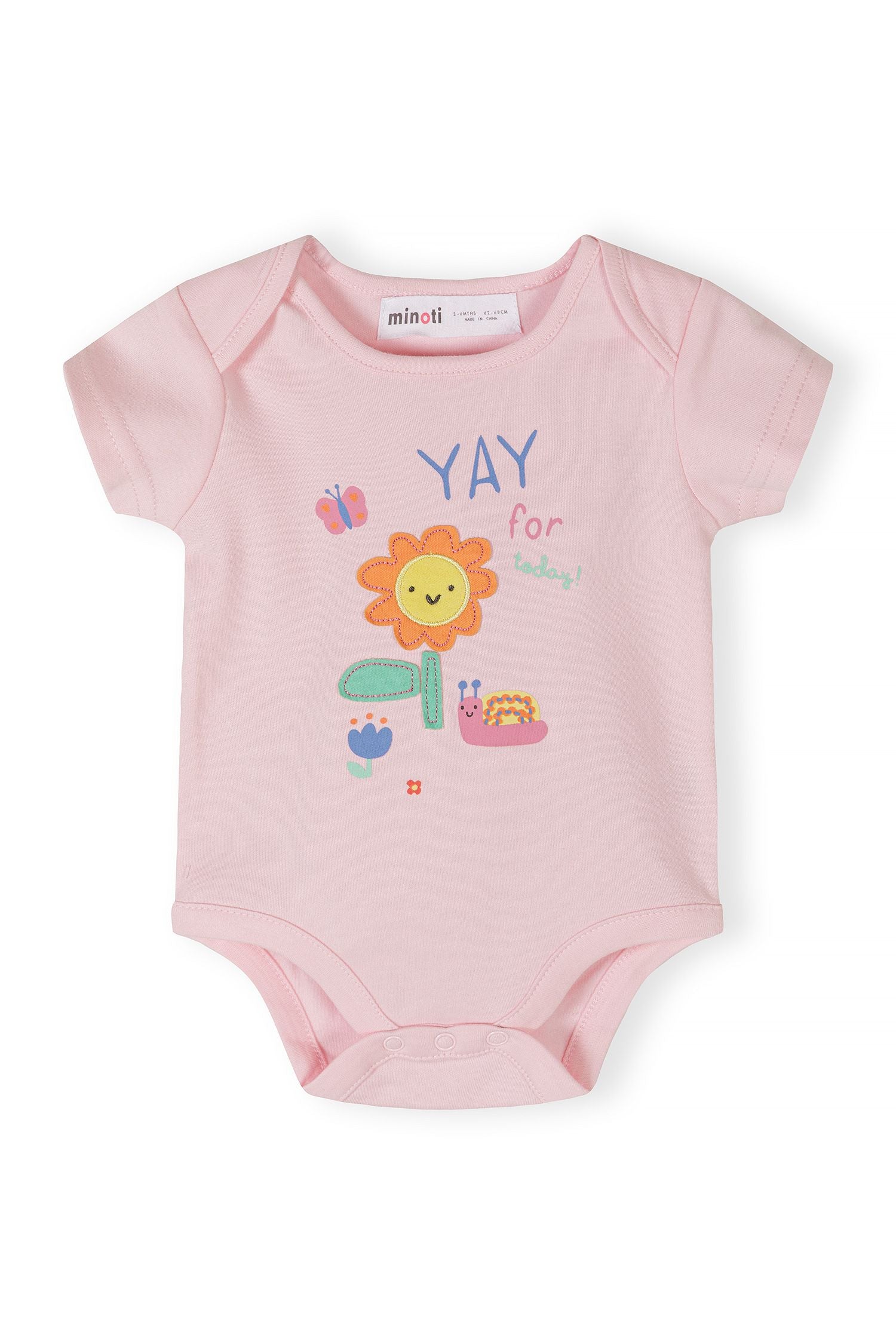 Close-up of a pink short-sleeve bodysuit with a flower and butterfly print.