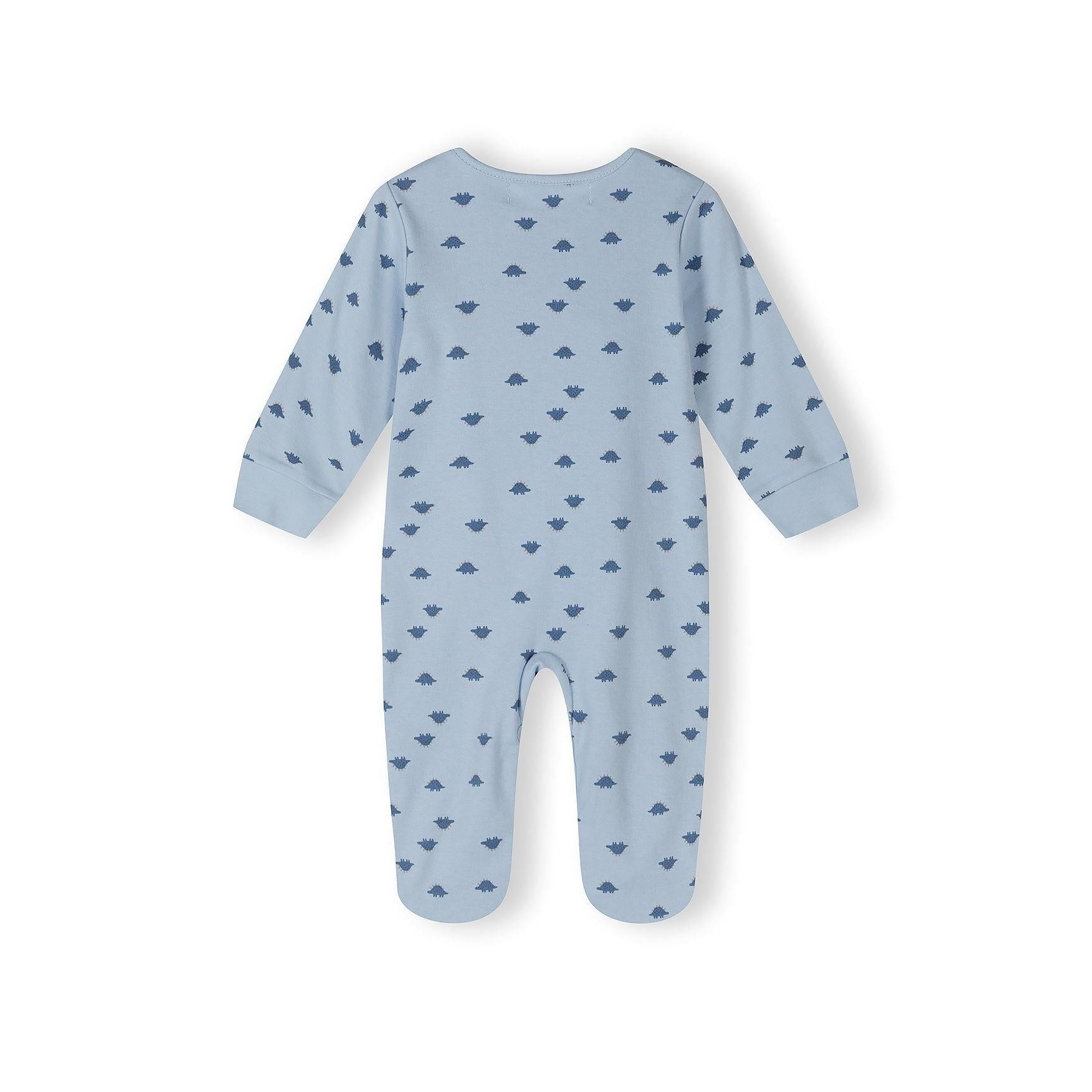 Close-up detail of blue and white striped sleepsuit showing Minoti label and embroidered dinosaur appliqué with red and white textured details