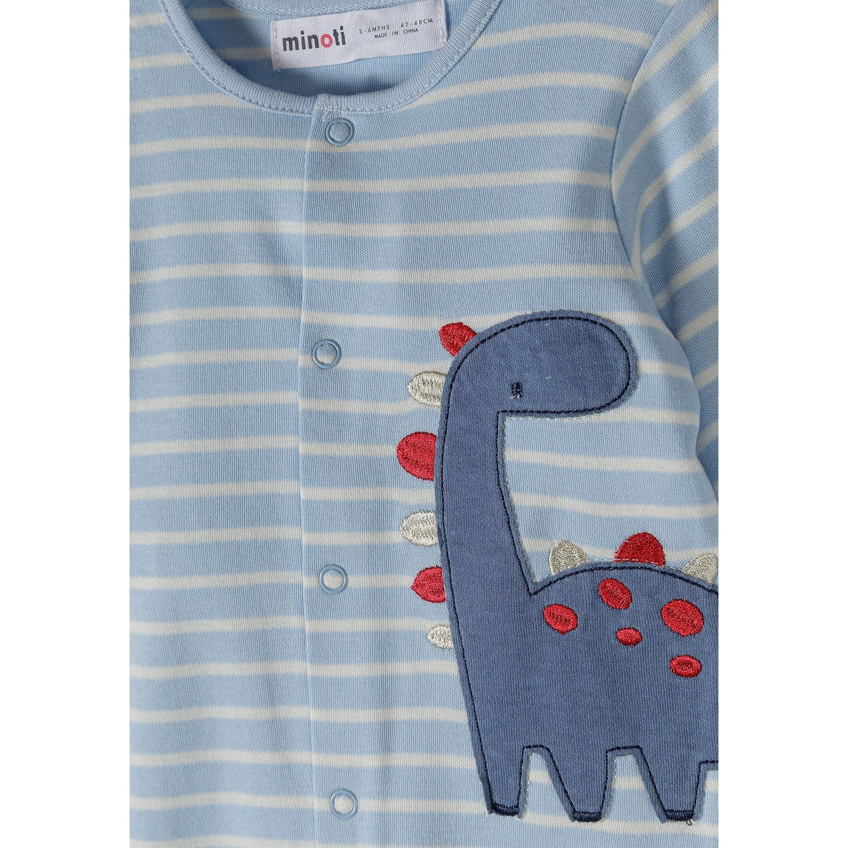Close-up detail of blue and white striped sleepsuit showing Minoti label and embroidered dinosaur appliqué with red and white textured details