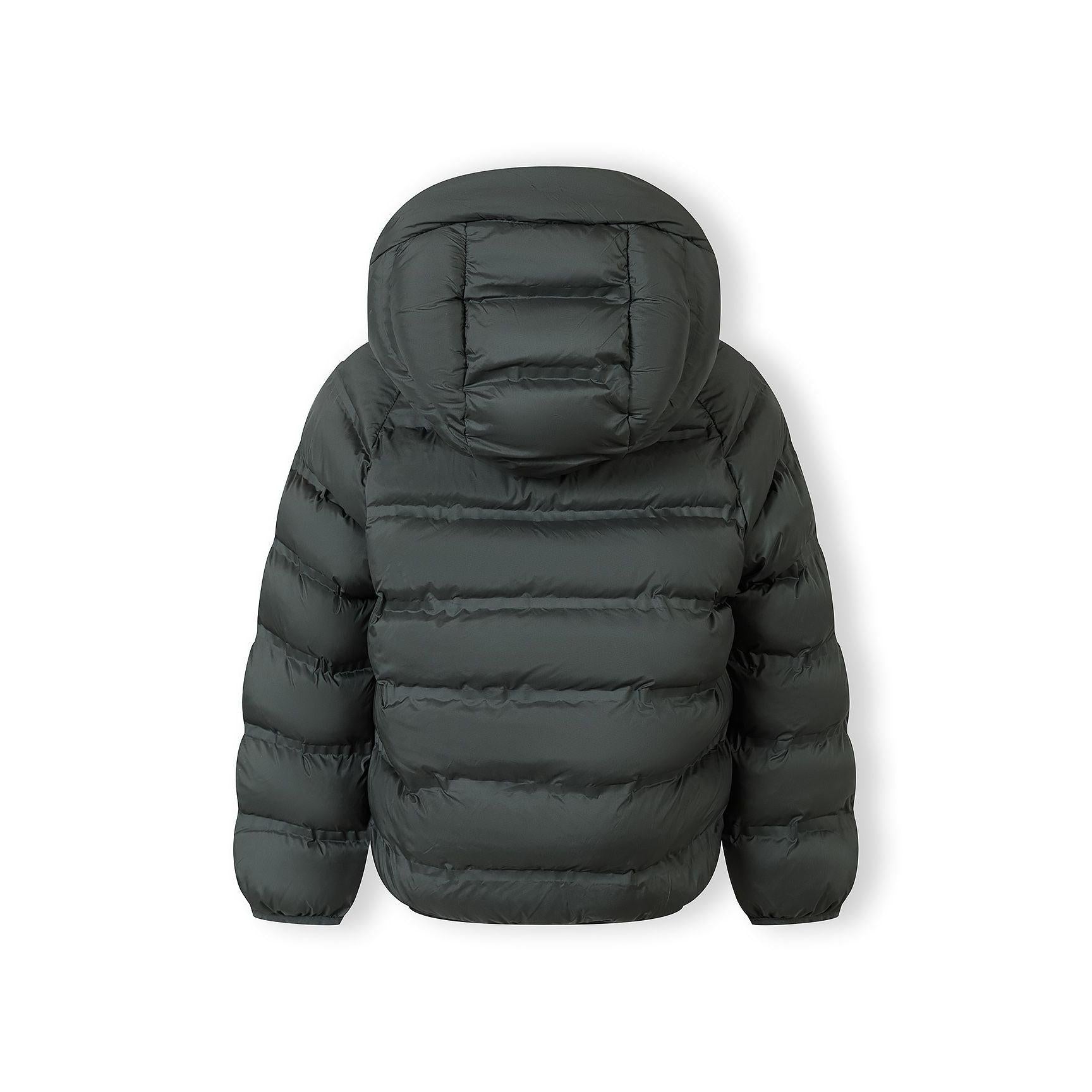 Close-up detail of emerald green padded jacket showing quilted texture and fabric construction