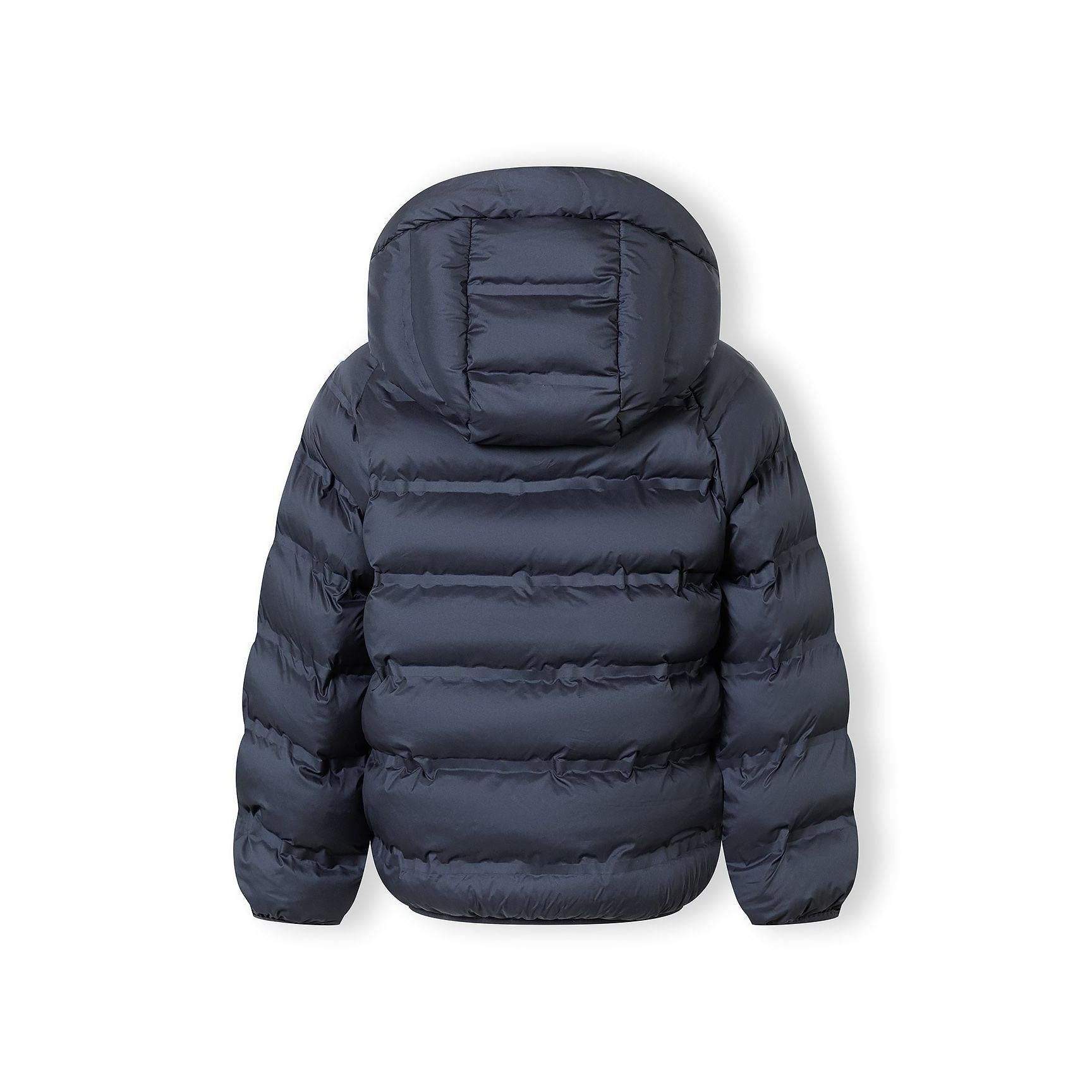 Close-up detail of navy quilted fabric texture showing stitching pattern and material finish